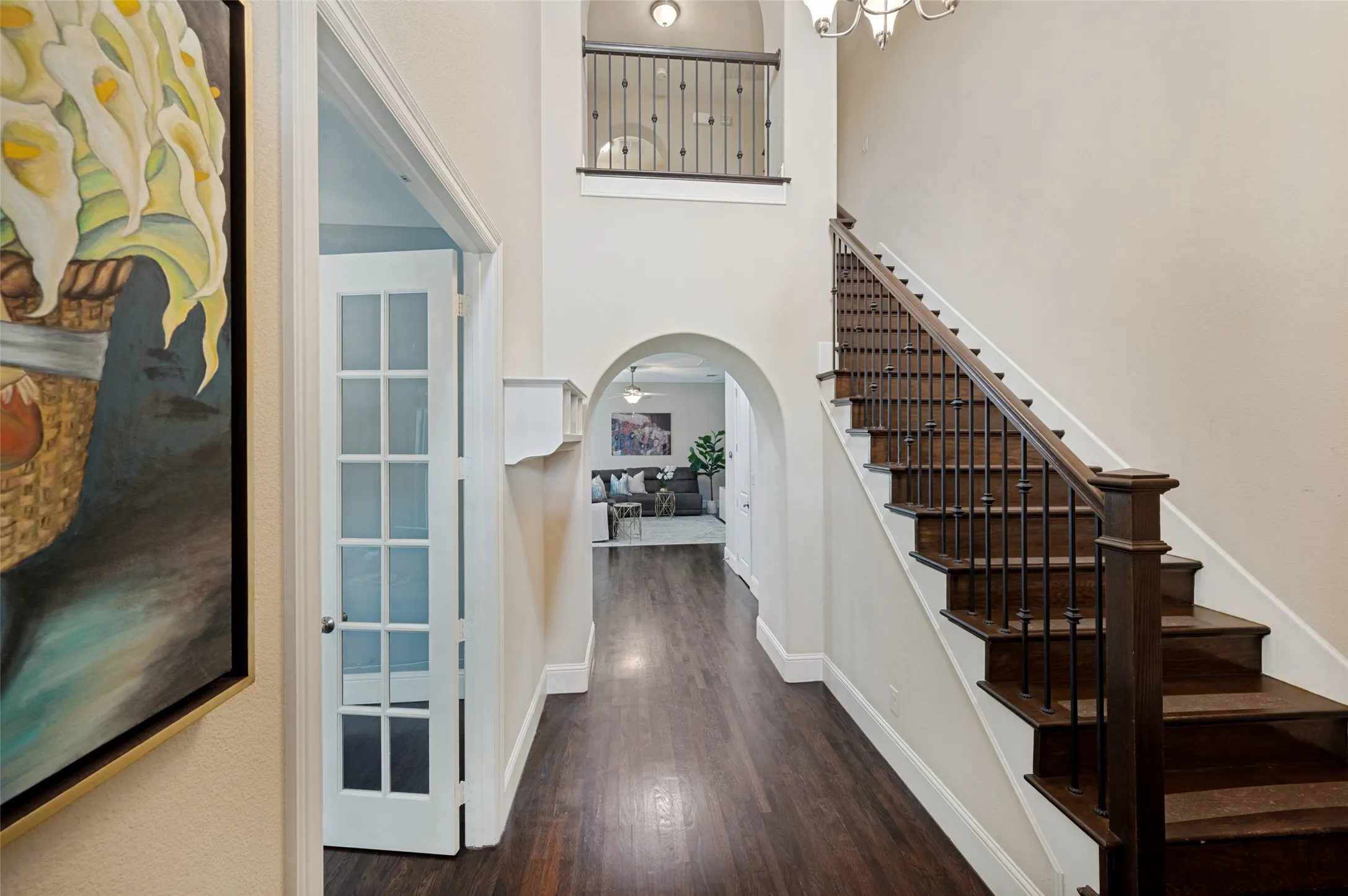 Hardwood floors and staircase to the second level.