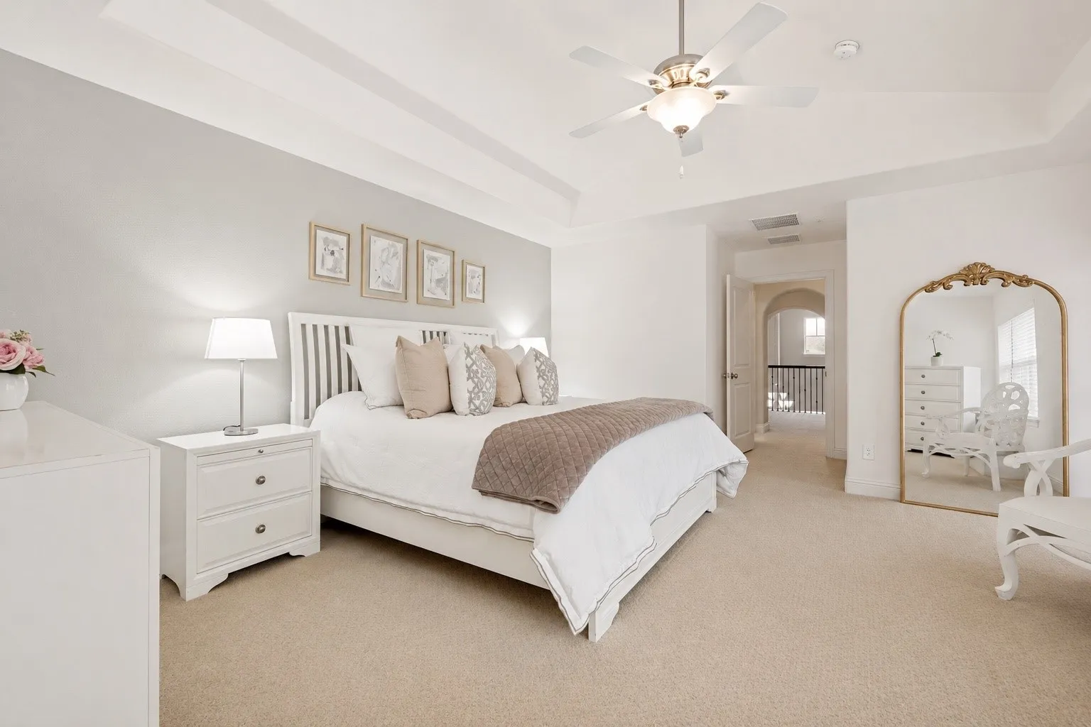 Primary suite with access to a private balcony.