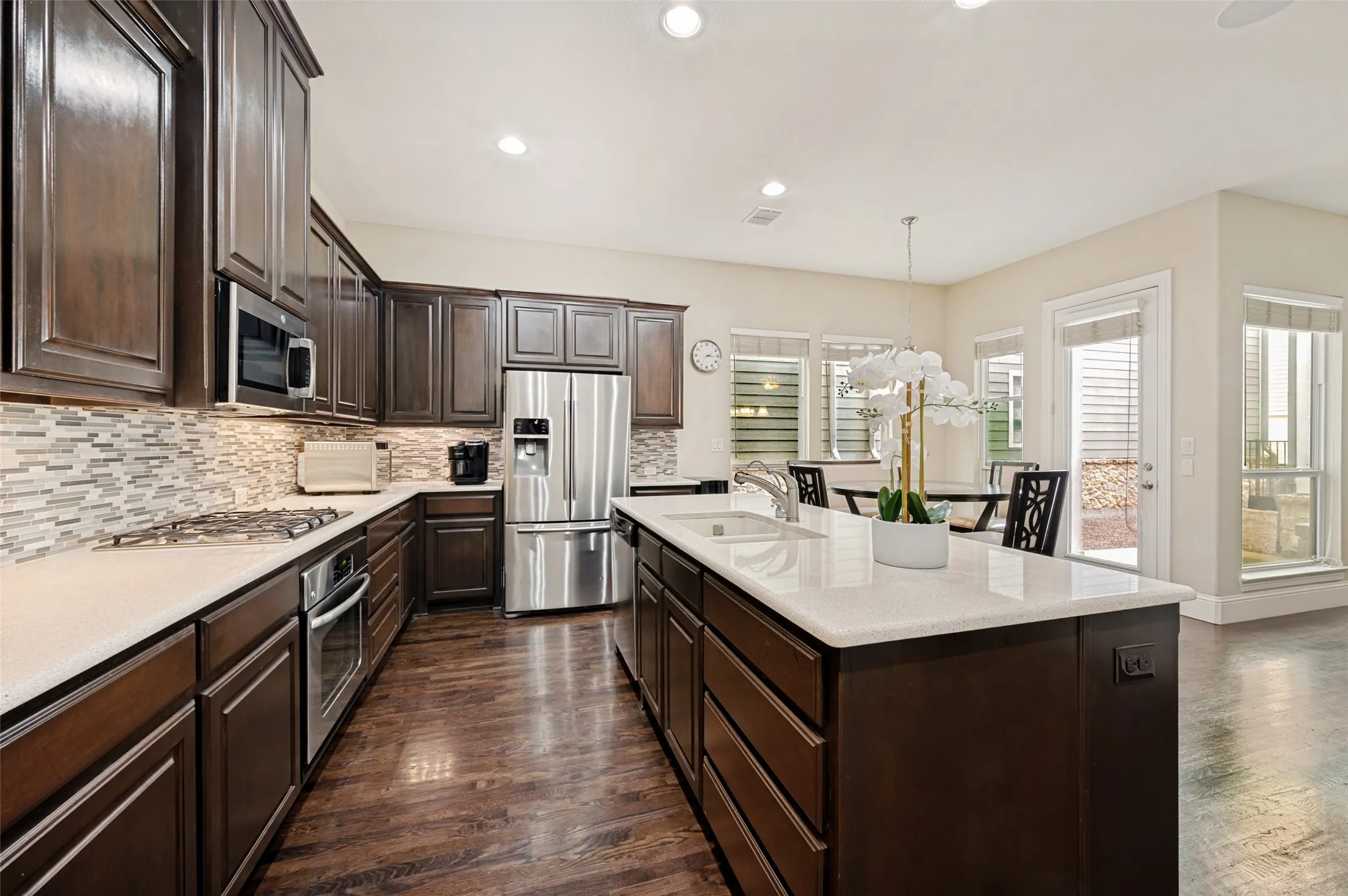 Granite countertops, stainless steel appliances and gas cooktop.