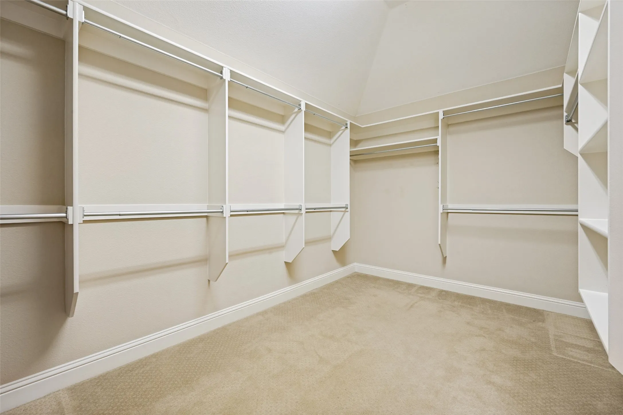 Spacious walk-in primary closet.