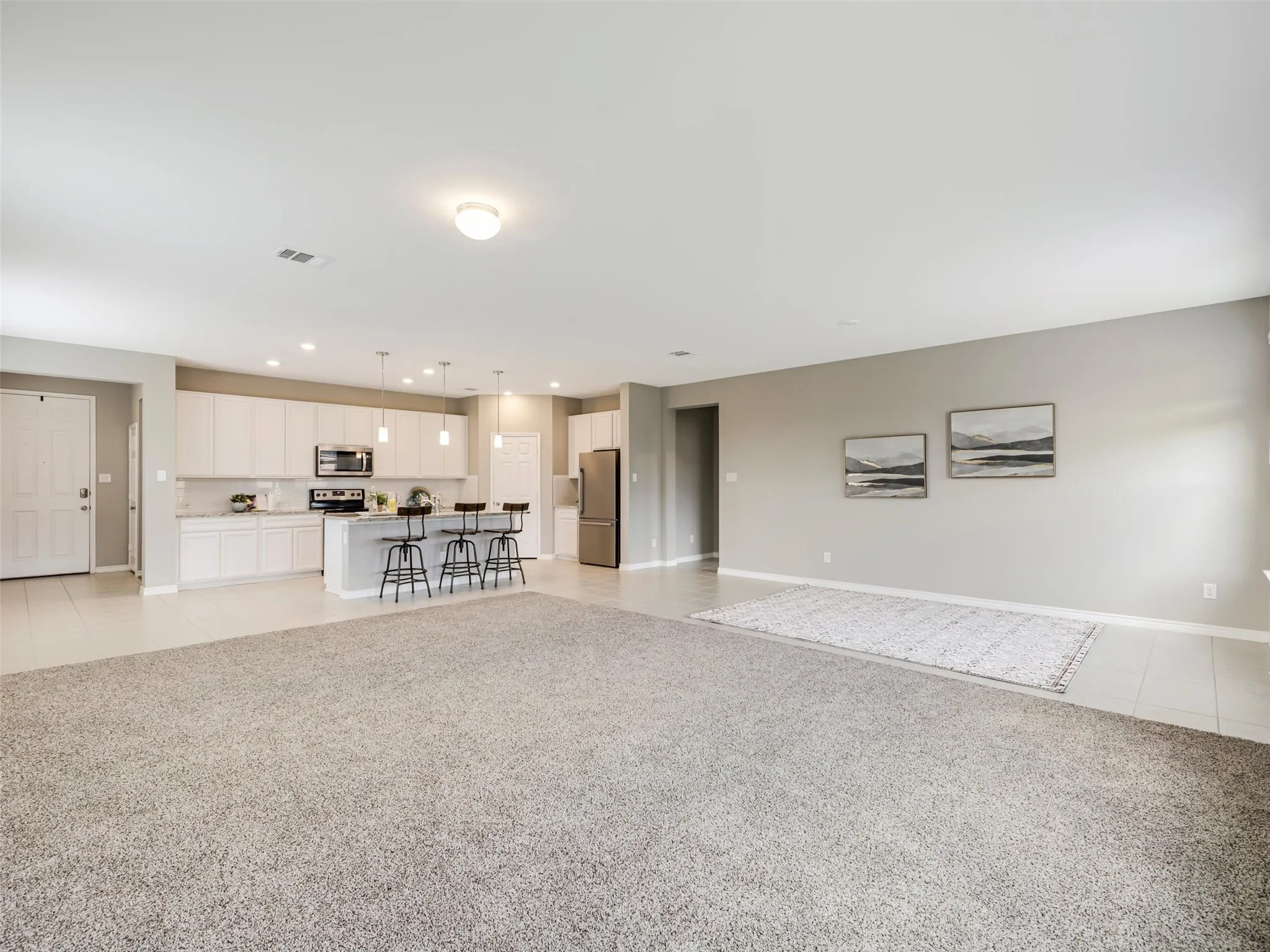 Open-concept floor plan seamlessly connects the spacious living and dining areas with the kitchen, creating an ideal setting for everyday living and gatherings.