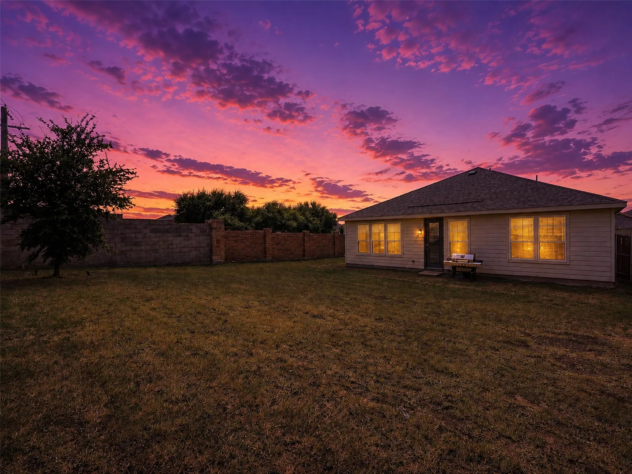 Spacious backyard with plenty of room for outdoor entertaining, recreation, pets, gardening, or creating a personalized outdoor retreat.