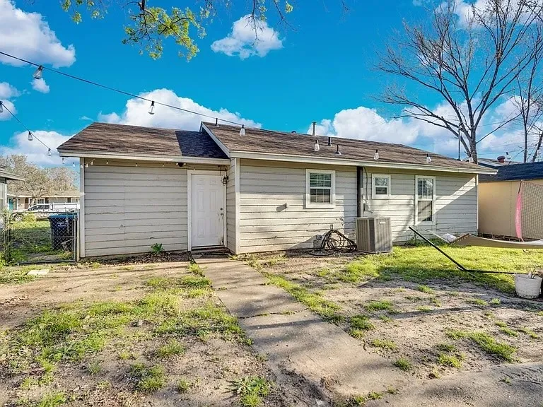 Charming single-story residence featuring horizontal vinyl siding, a pitched roof with asphalt shingles, and a covered front entry