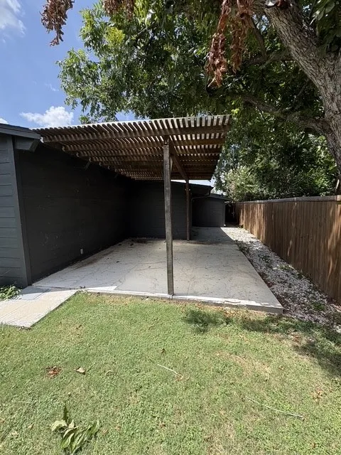 Covered patio with a pergola.