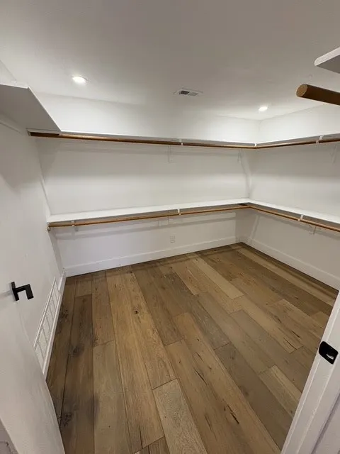 Primary bedroom walk-in closet.
