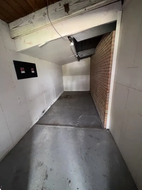 Storage area.  Access from the carport.