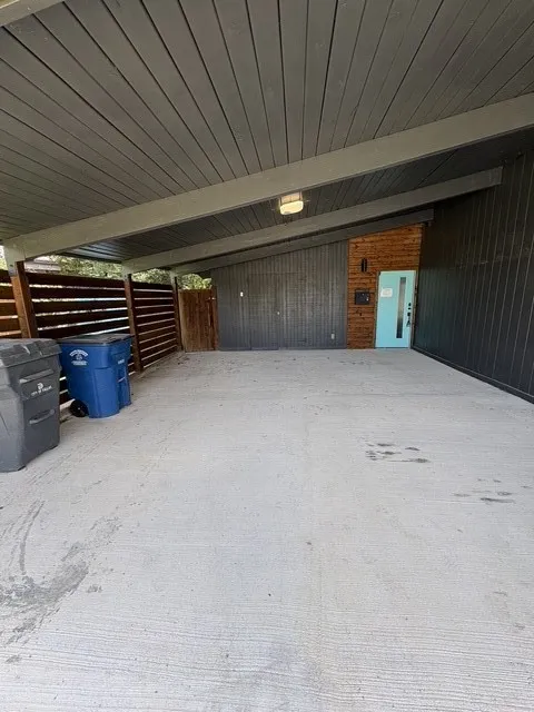 Two car carport. Front entry. Storage room.