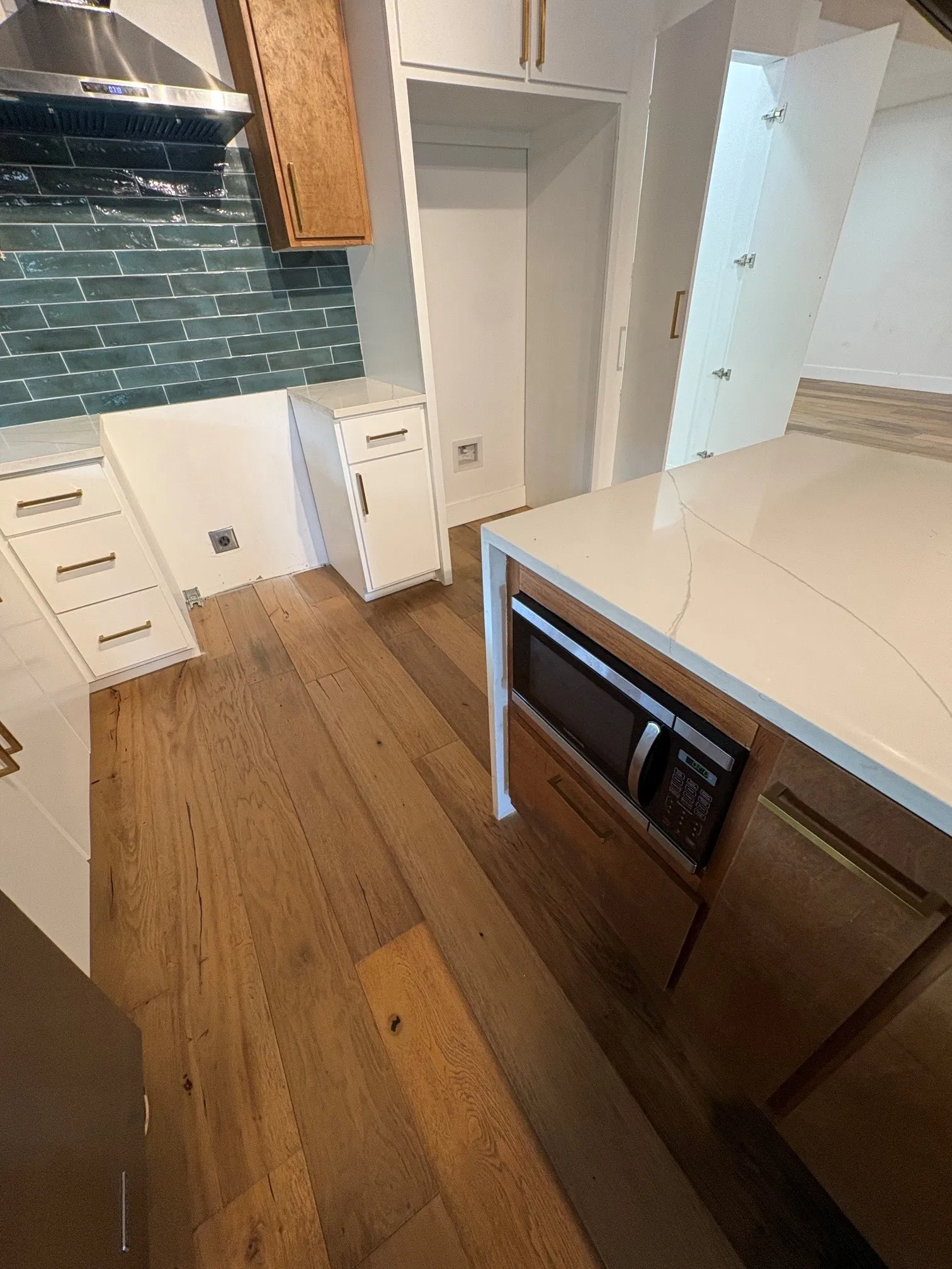 Microwave located in island.