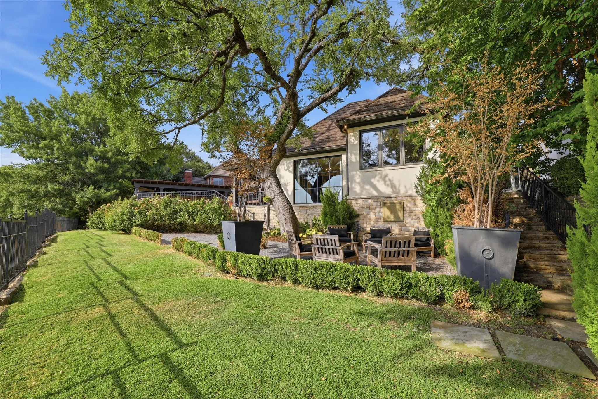 Tiered back yard offers idyllic views. The perfect way to start or end the day!