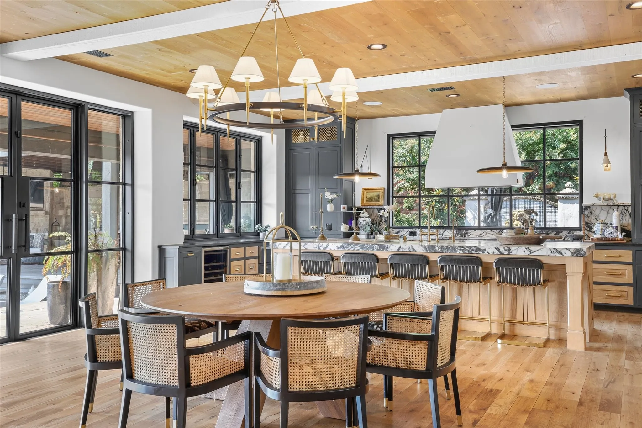 Casual dining becomes a design moment with statement lighting and views into the beautifully appointed kitchen.