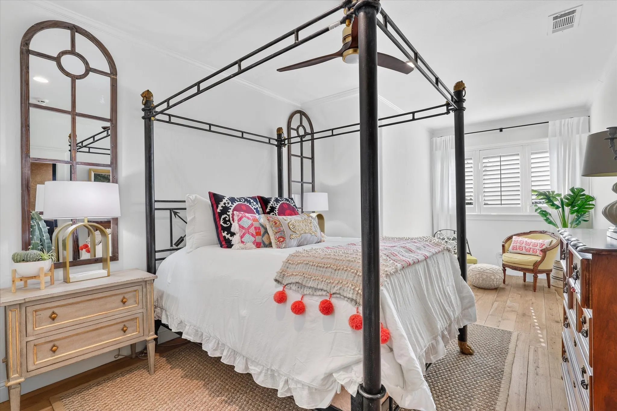 Light-filled secondary bedroom combines generous proportions with distinctive architectural character.