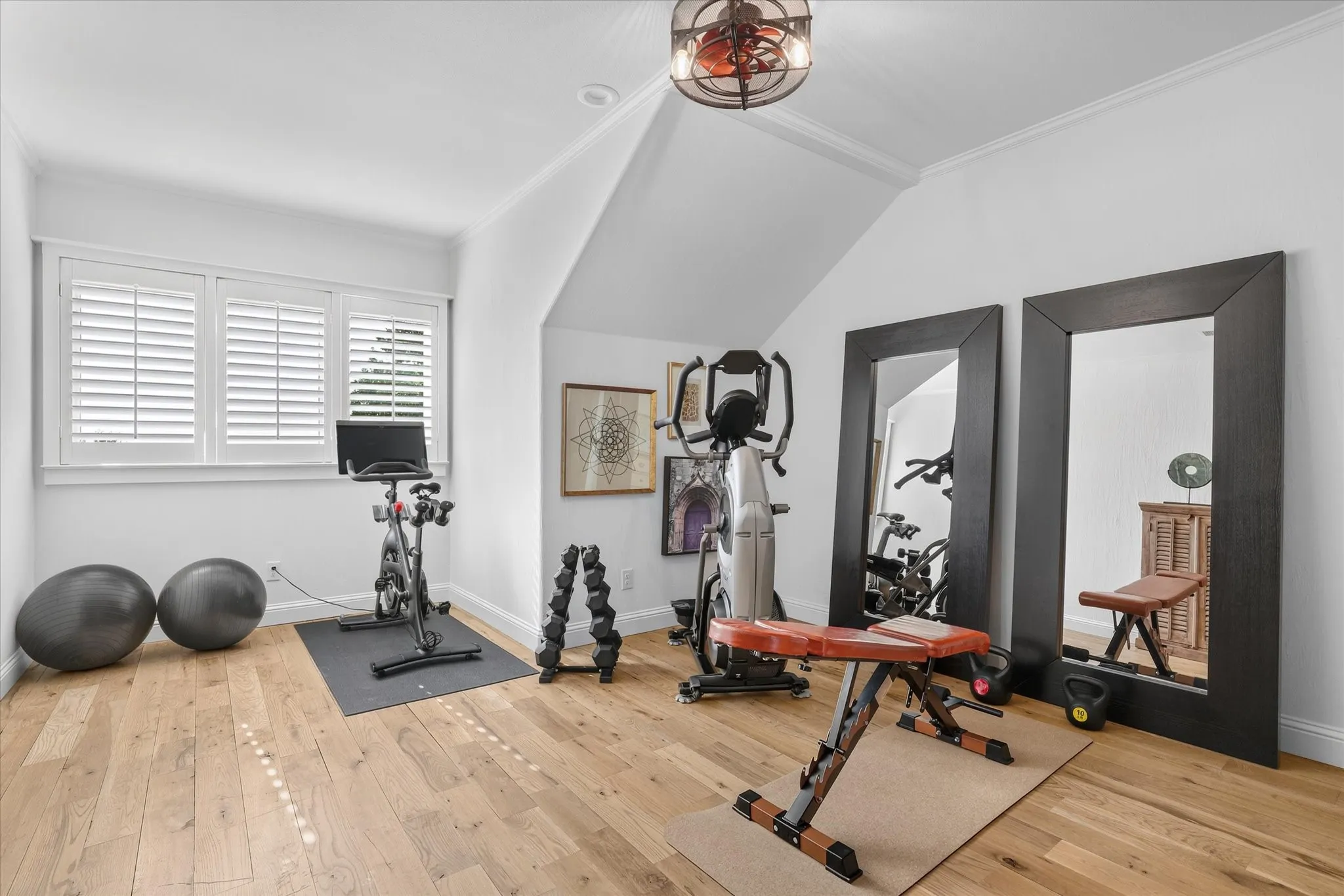 Flexible secondary bedroom currently styled as a private fitness studio.