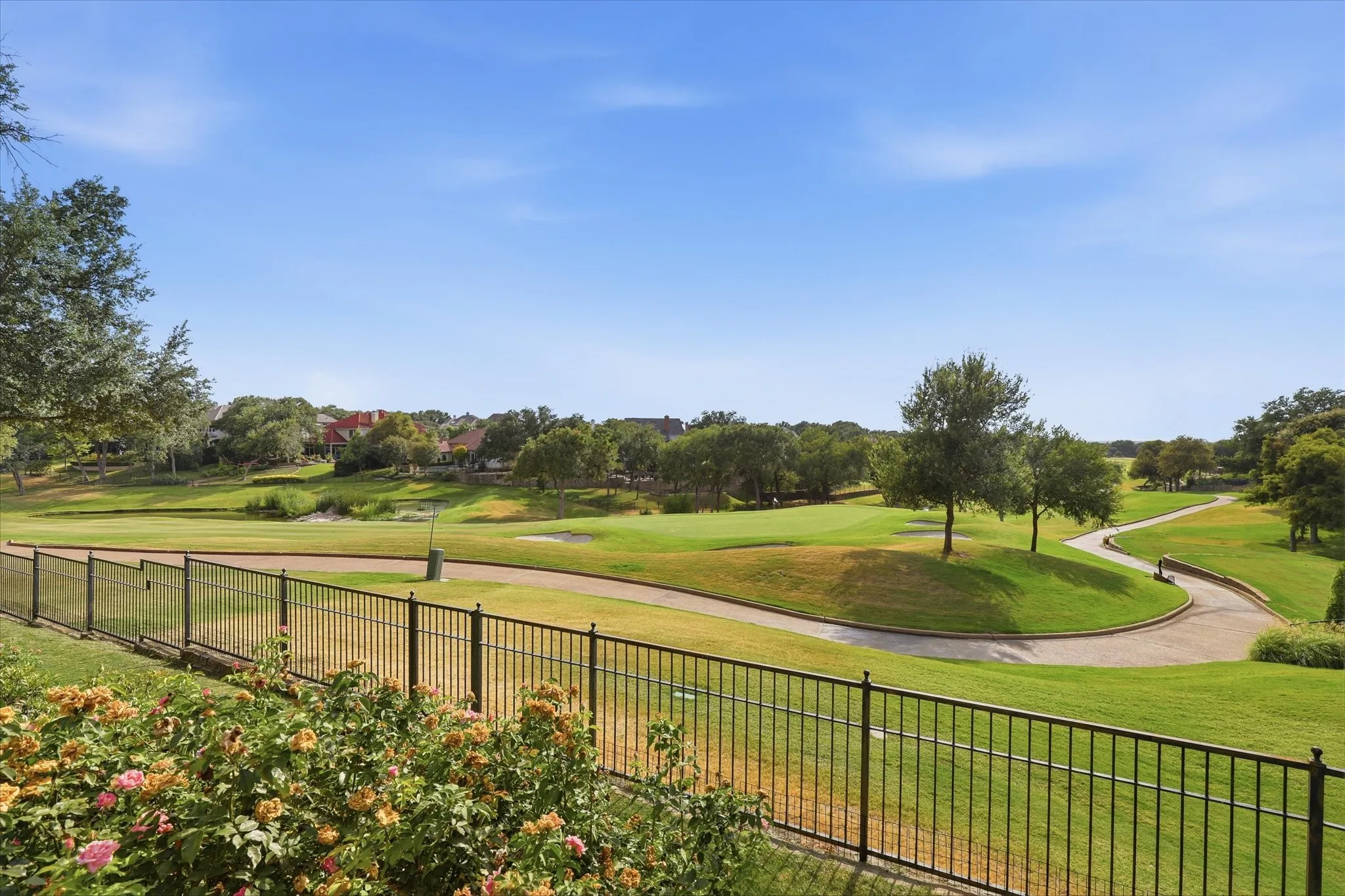 Sweeping golf course views create an exceptional backdrop for the home and outdoor living spaces.