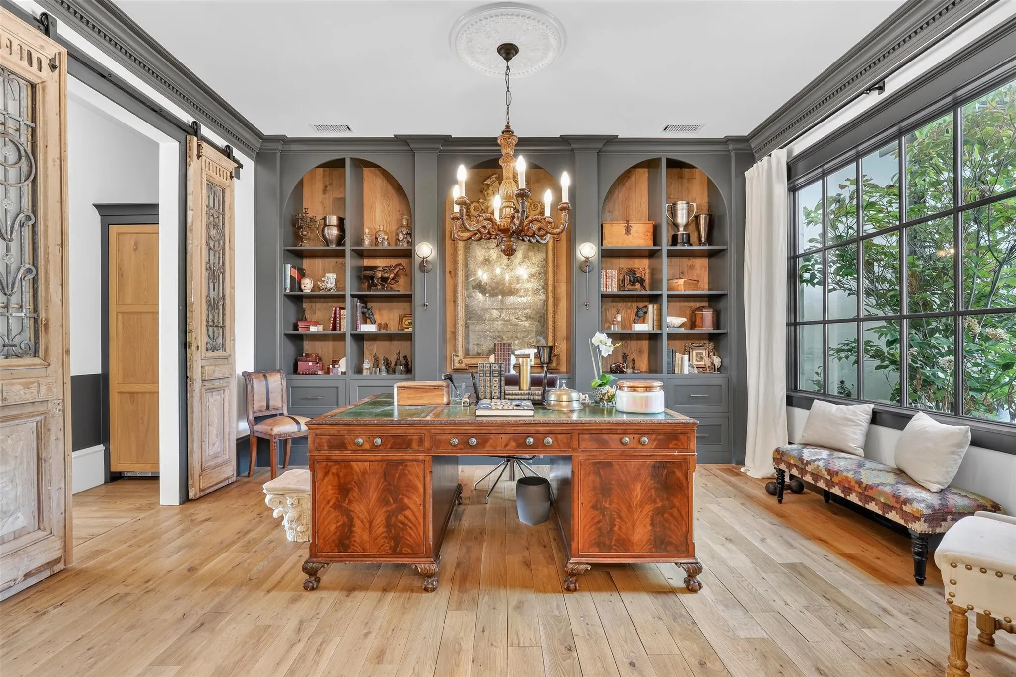 Handsome private study with custom built-ins, abundant natural light and distinctive architectural details.