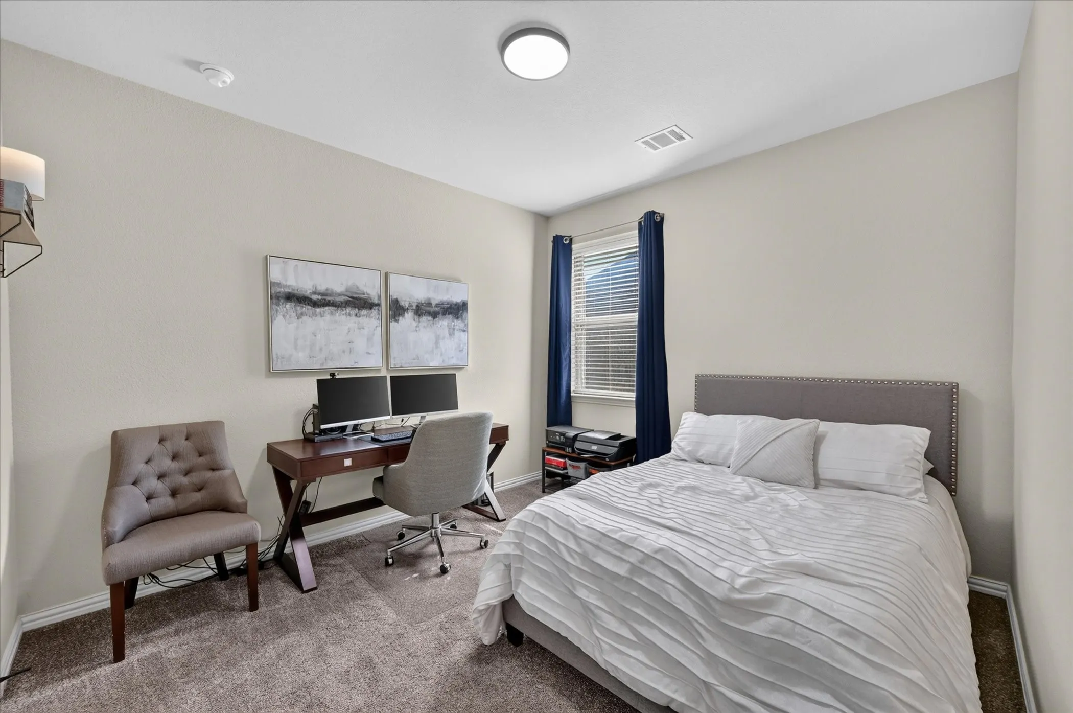 Neutral painted walls, wall-to-wall carpeting, window with blinds, and flush mount lighting