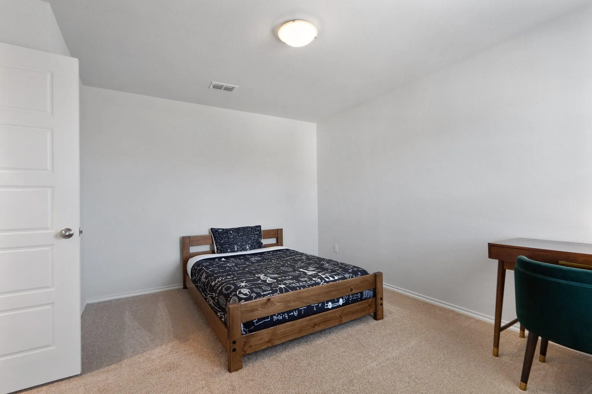 Bedroom with baseboards, visible vents, and carpet