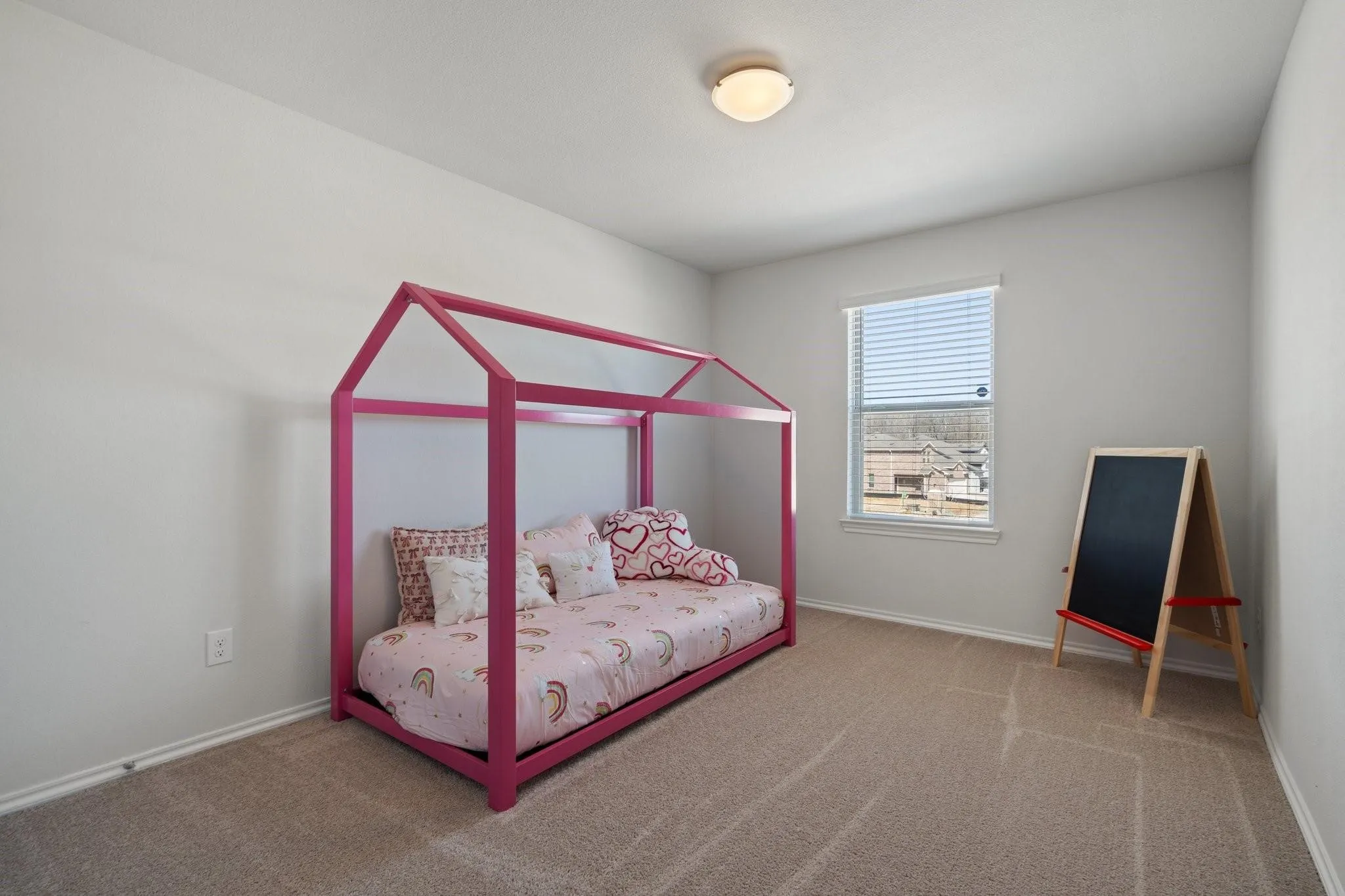 Bedroom featuring baseboards and carpet flooring