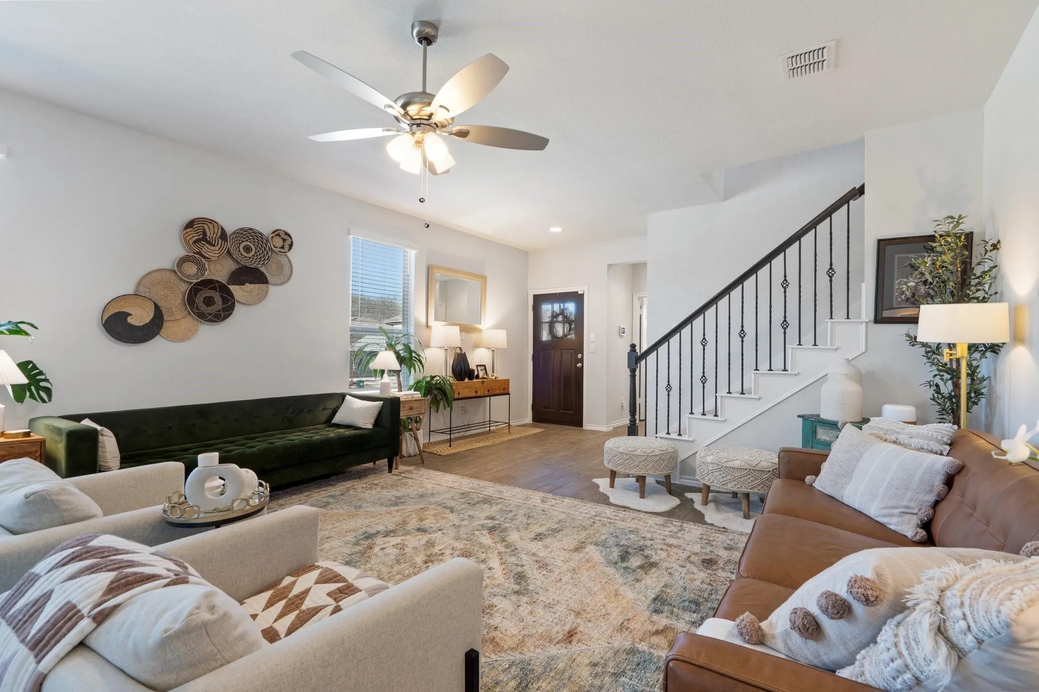 Living room featuring visible vents, recessed lighting, wood finished floors, stairway, and ceiling fan