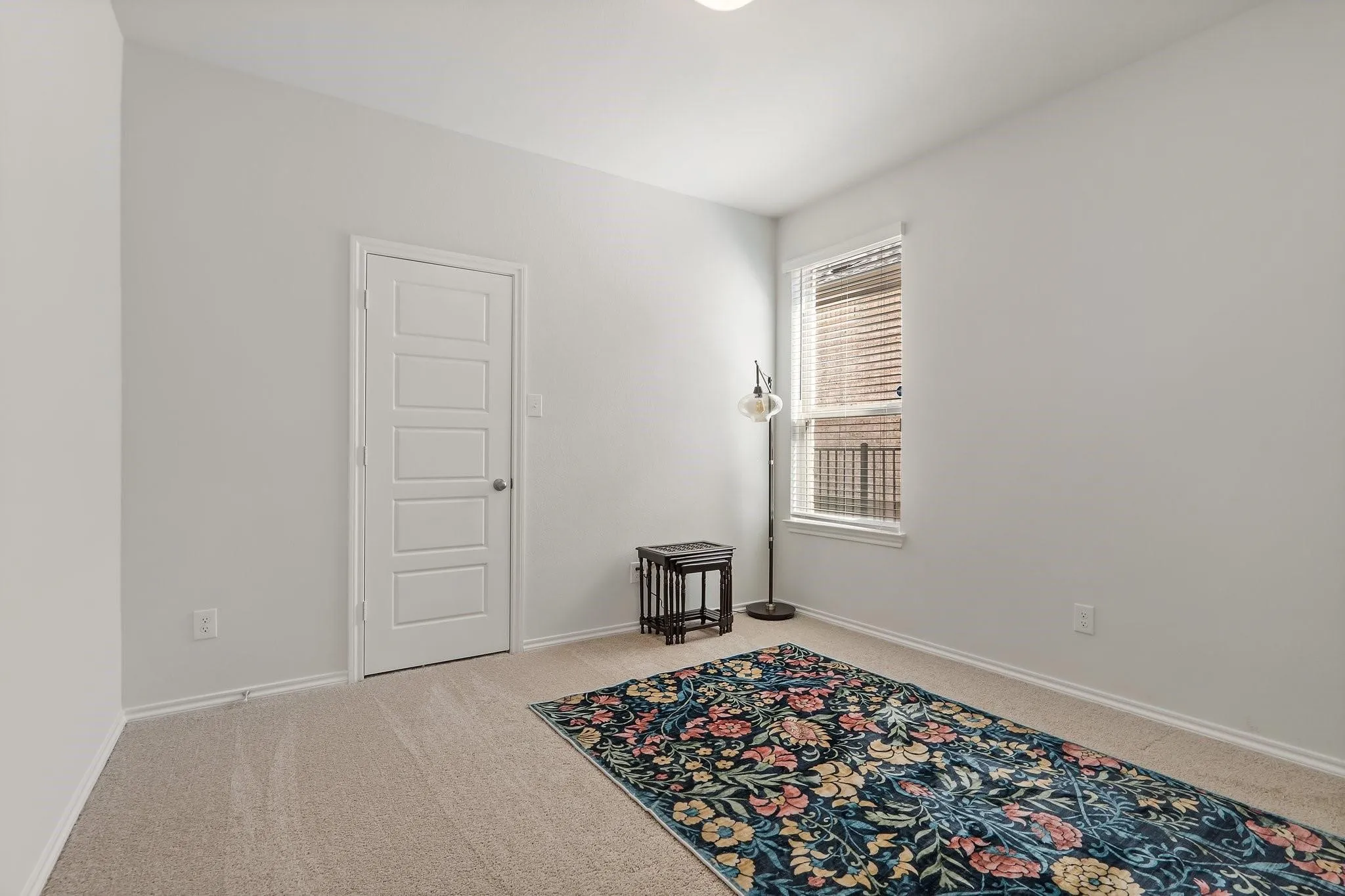 Empty room with baseboards and carpet