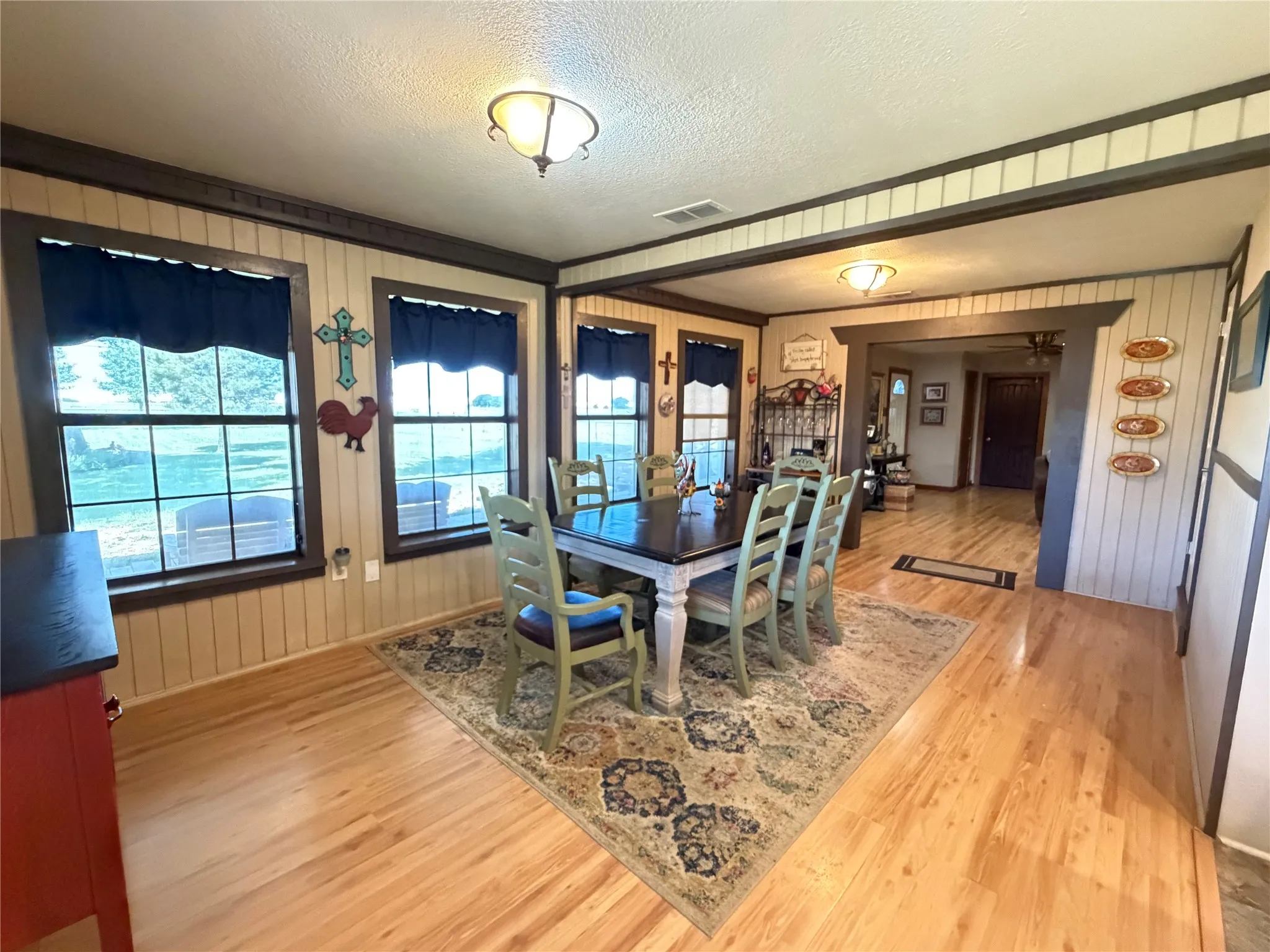 Hardwood flooring, multiple windows, recessed lighting, and a wide entryway