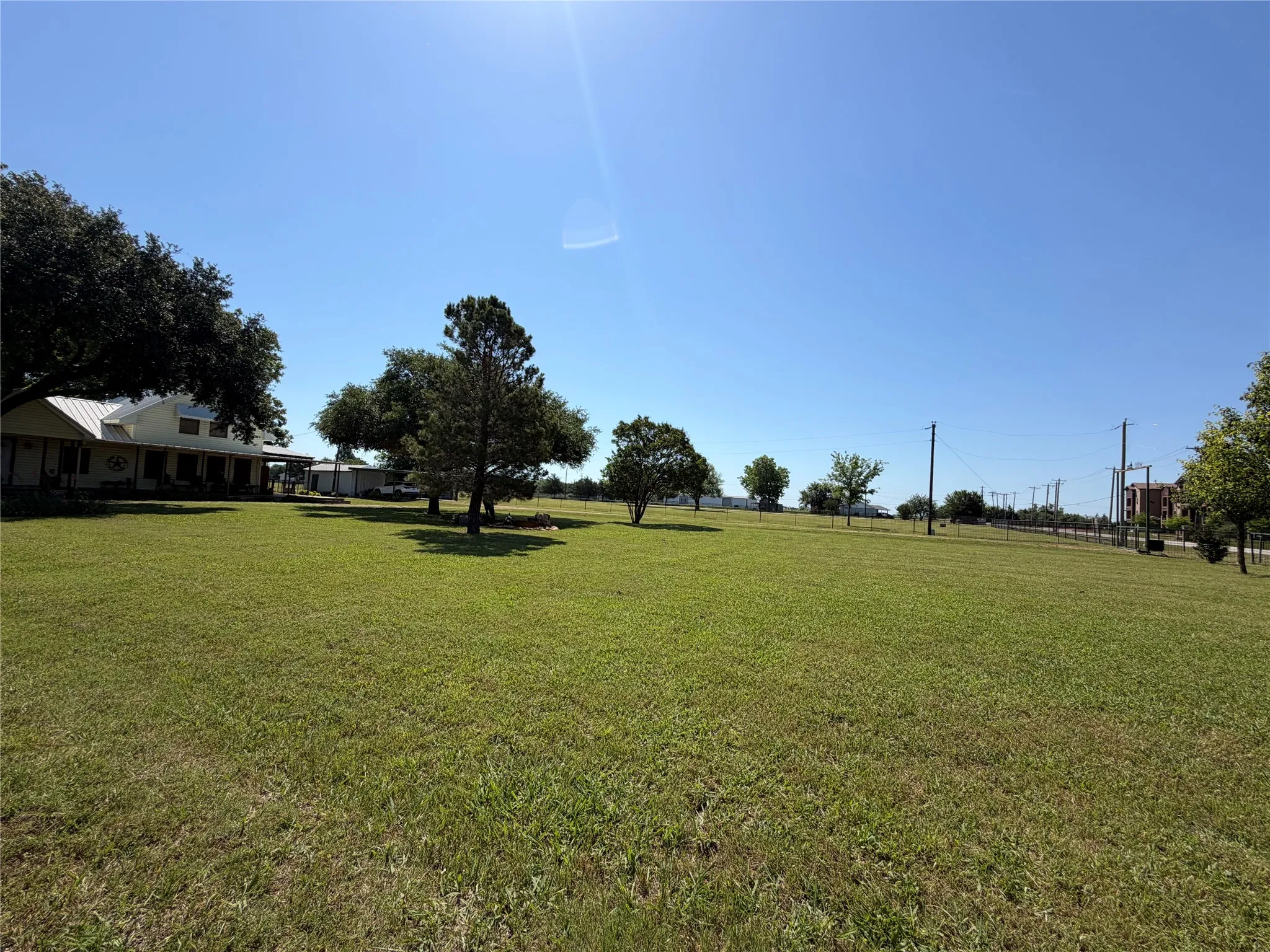 Expansive green space with mature trees