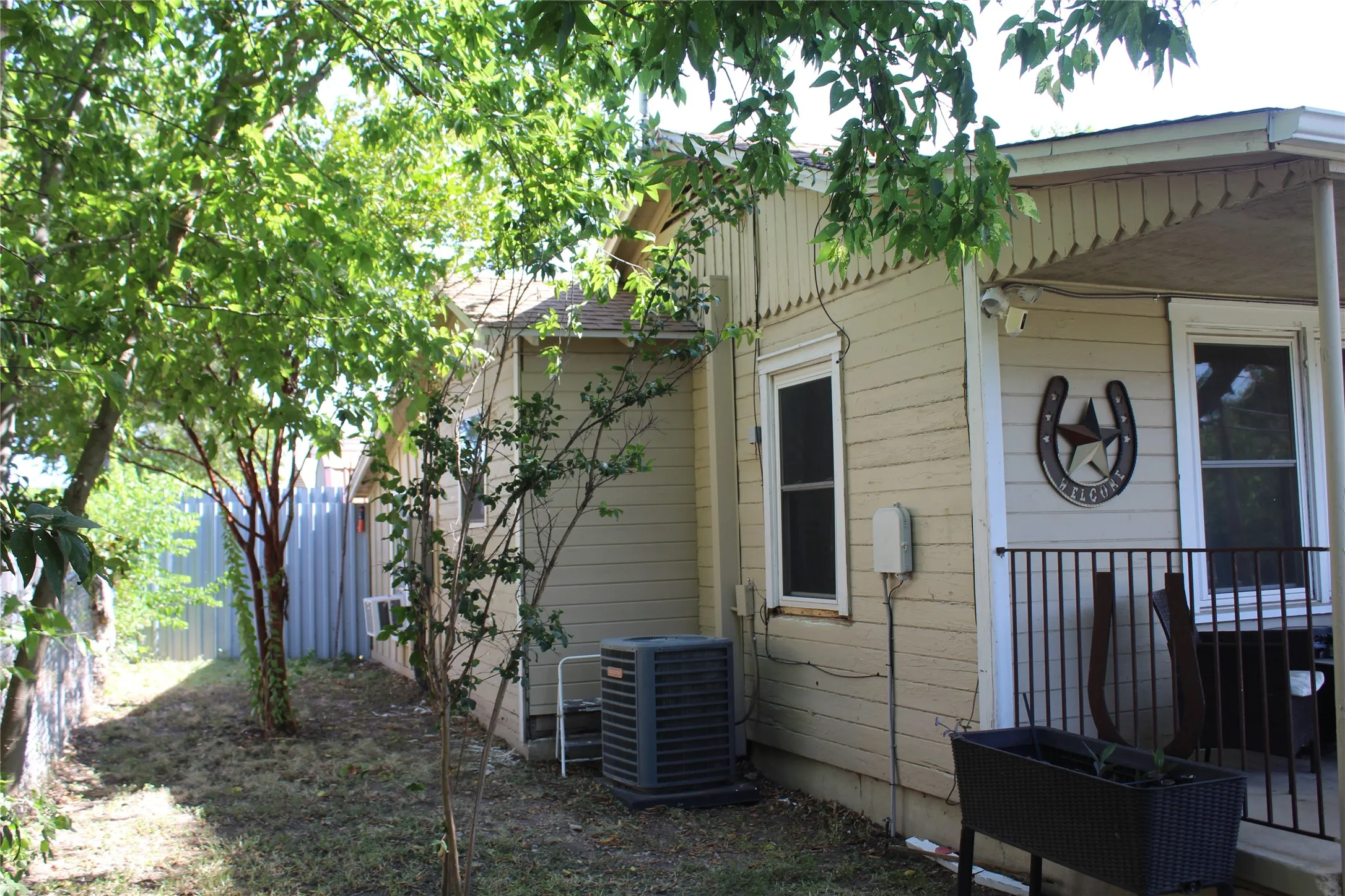 Side yard with mature trees