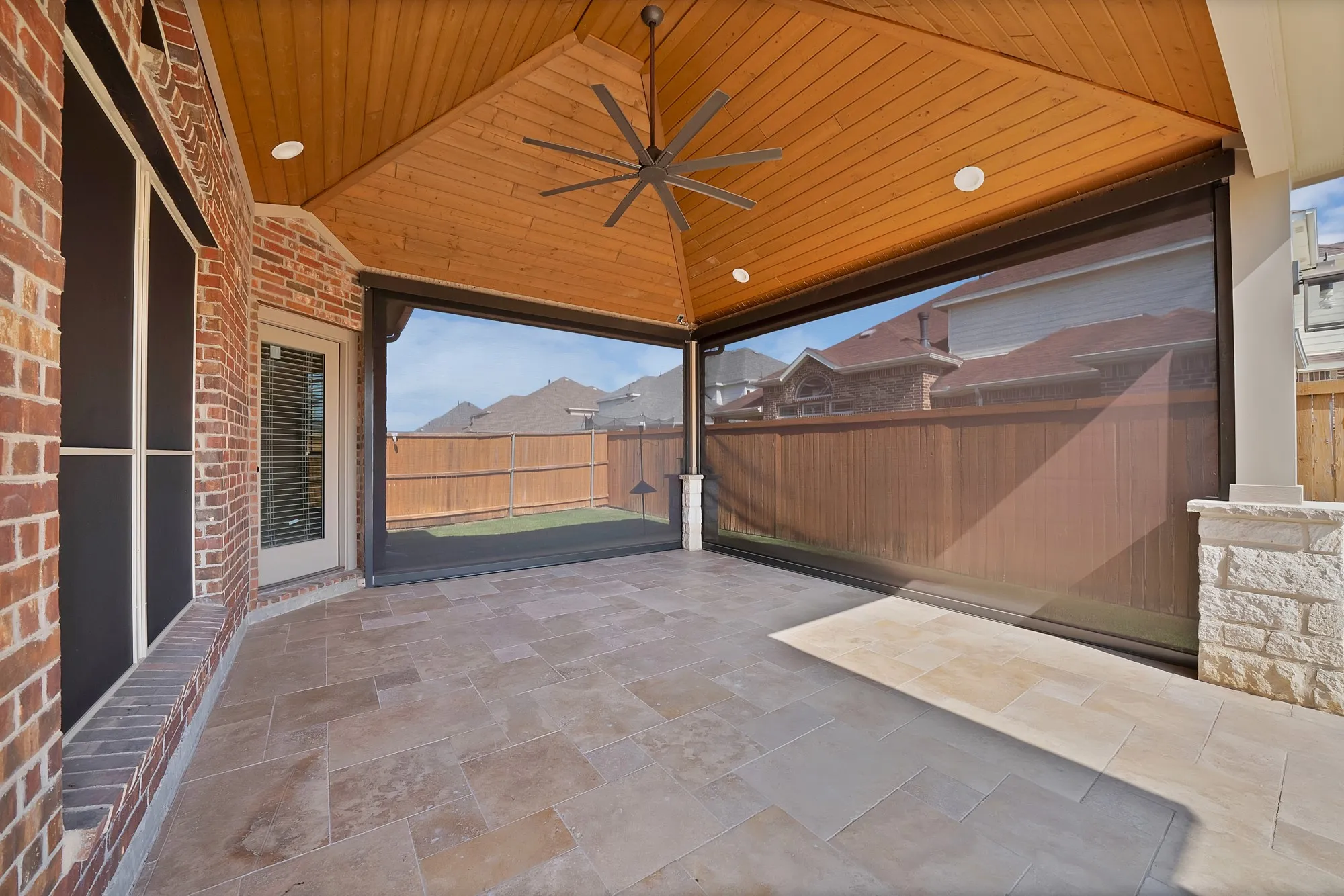 Covered patio featuring an exposed wood plank ceiling, recessed lighting, and a ceiling fan