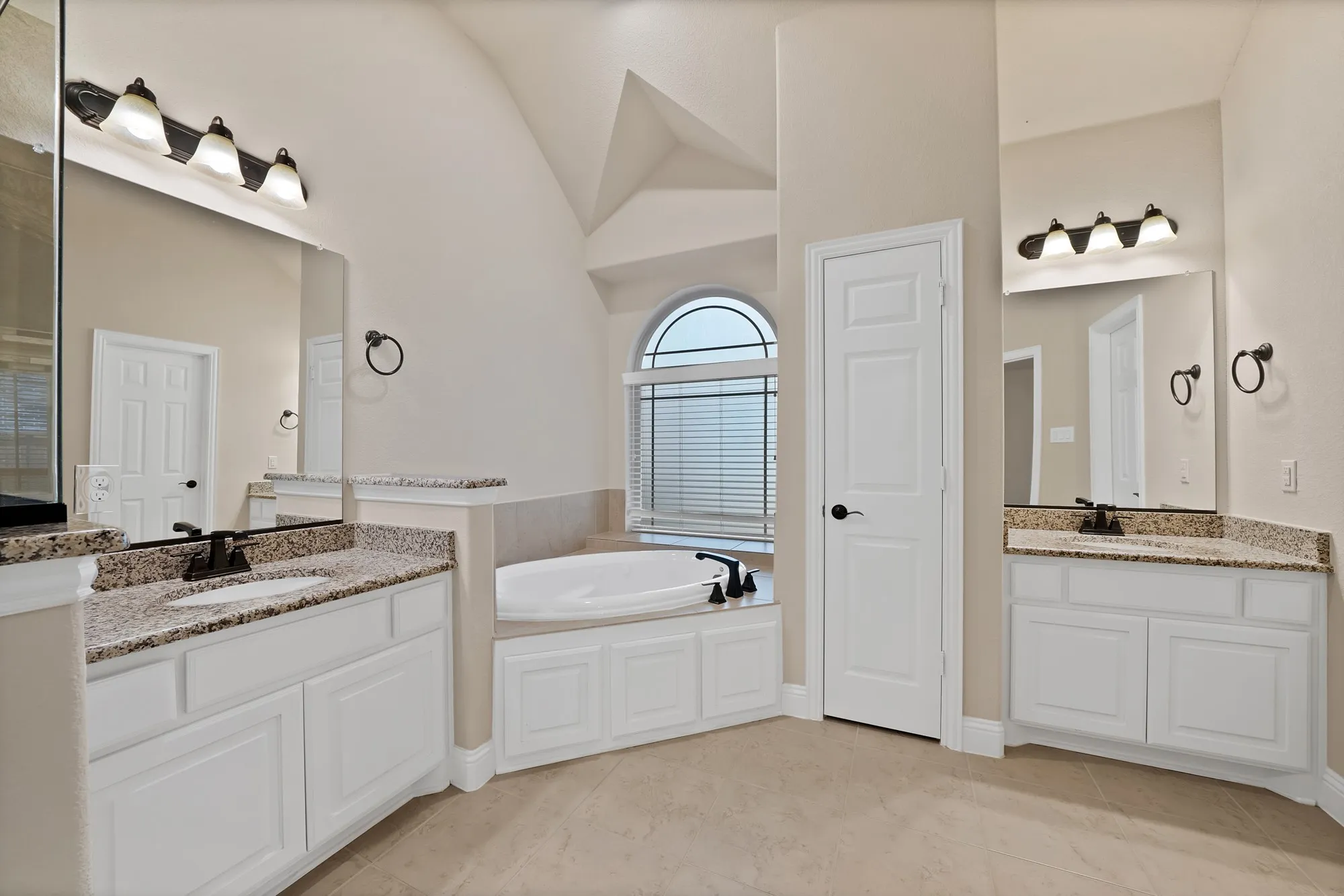 Dual vanity sinks with granite countertops