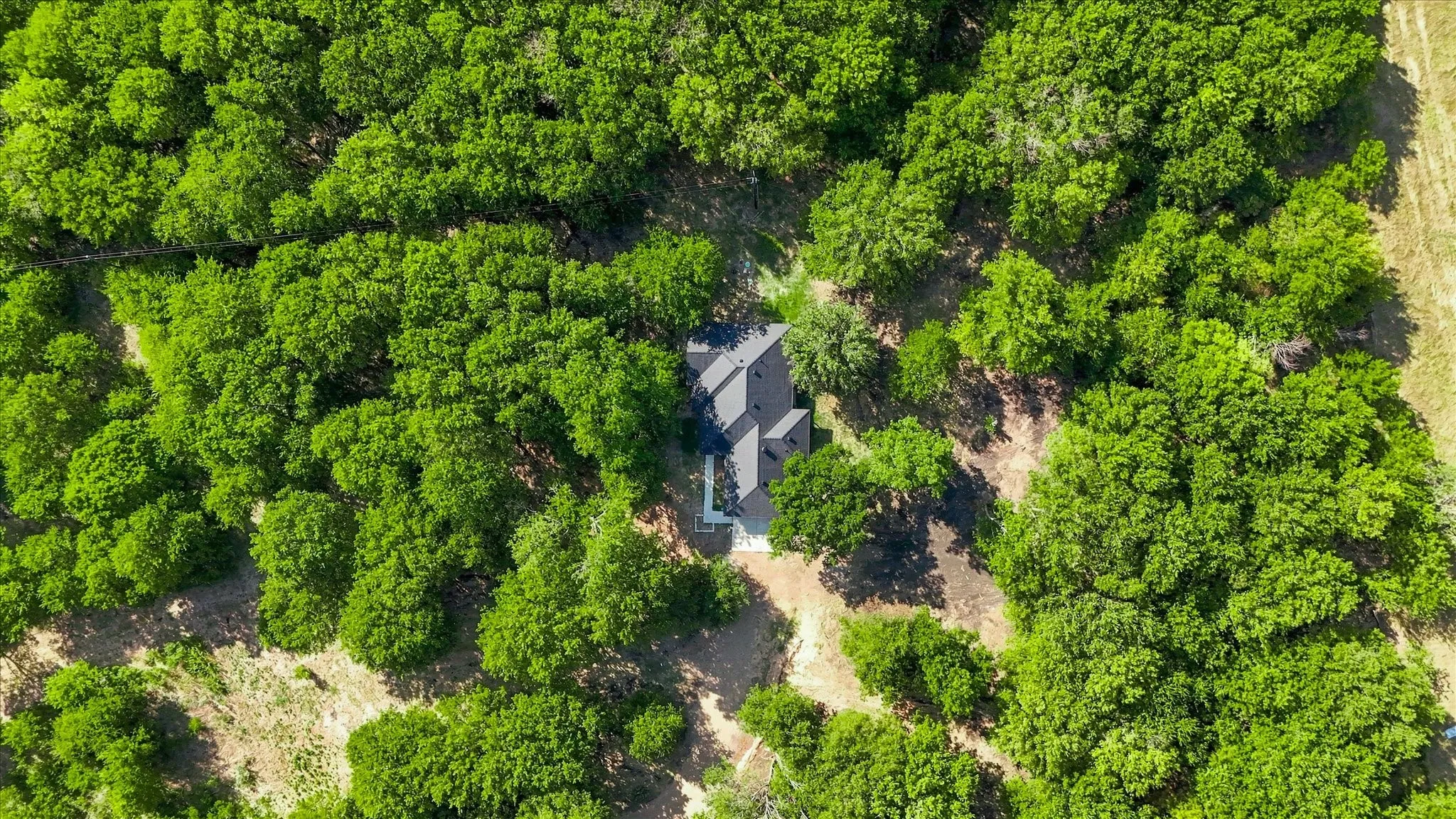 Additional contentThe aerial perspective does not provide sufficient detail of permanent architectural features, structural elements, hardscaping finishes, or built-in fixtures to craft a compliant, factually grounded caption