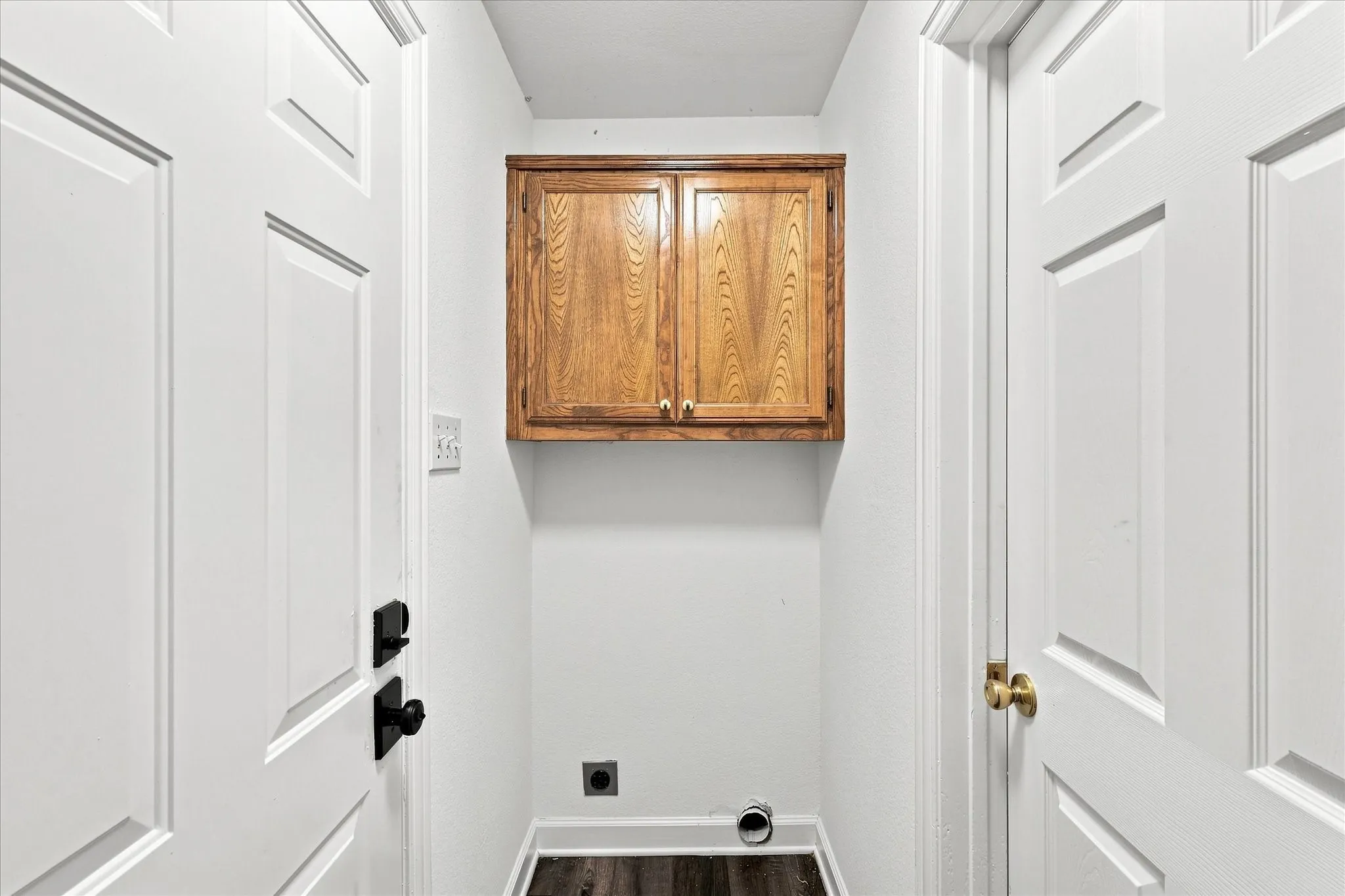 Integrated wood-finish cabinetry provides storage