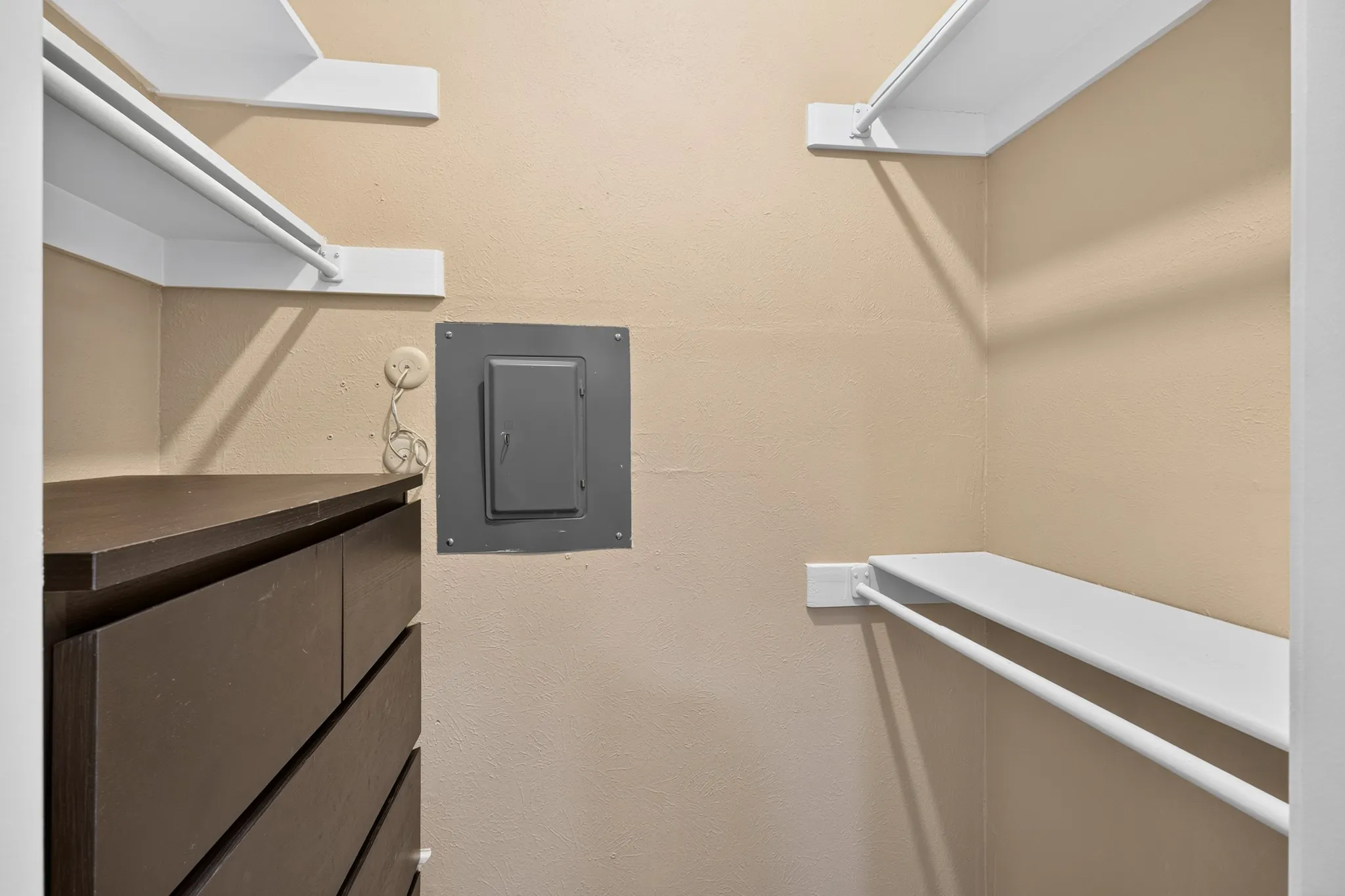 Built-in shelving and hanging rods for organized storage
