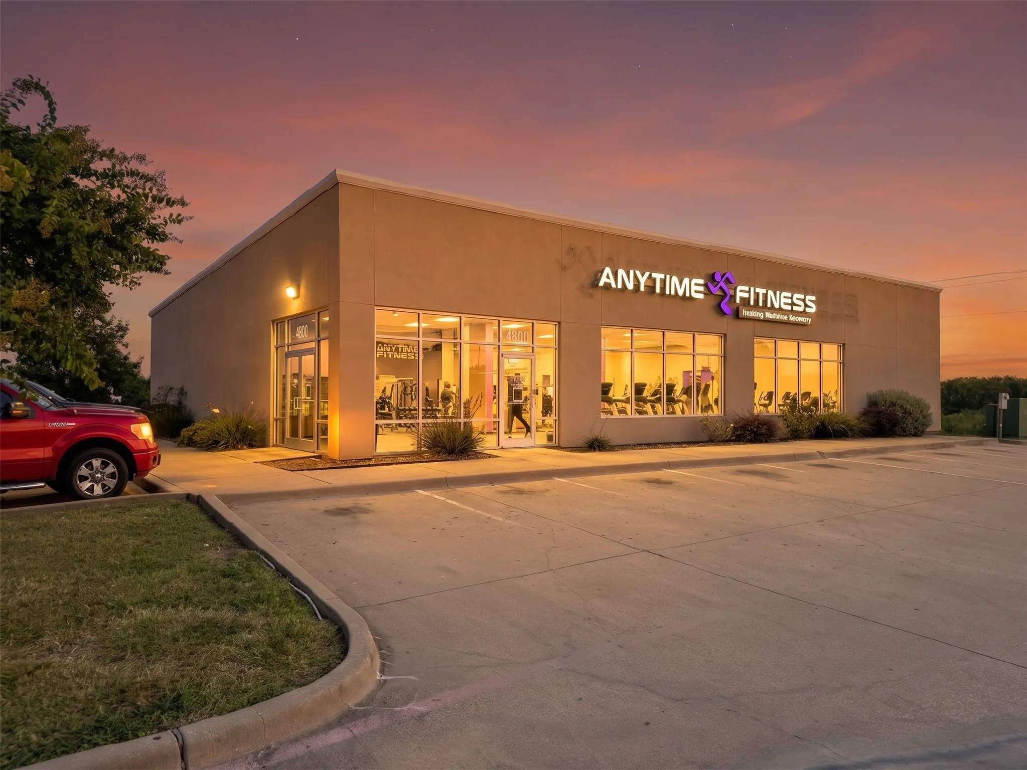 Commercial building with a stucco exterior and prominent illuminated signage