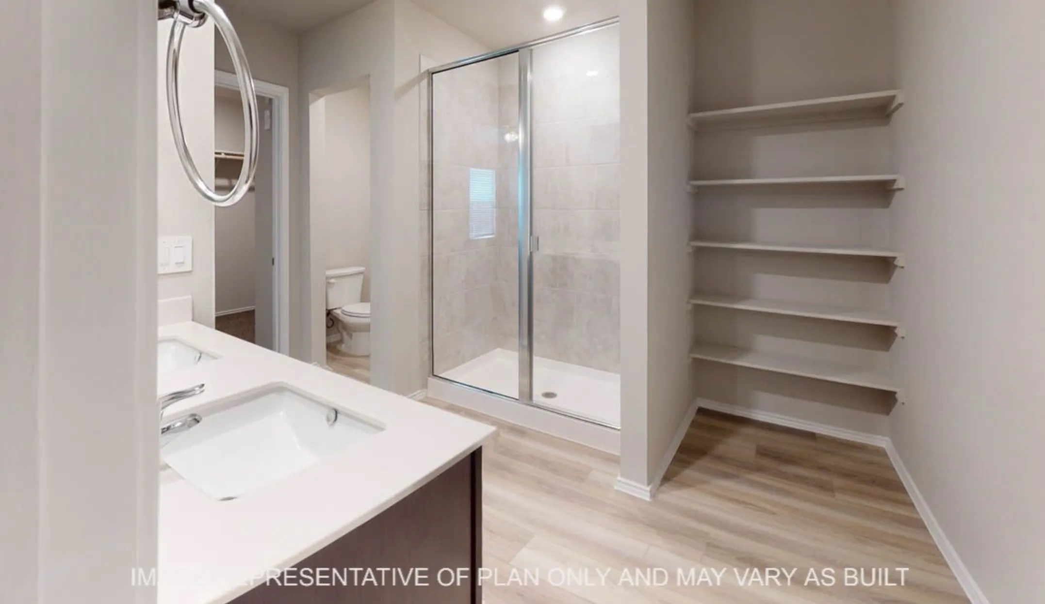 Modern primary bathroom featuring a floating vanity with rectangular vessel sink, quartz countertop, and chrome faucet