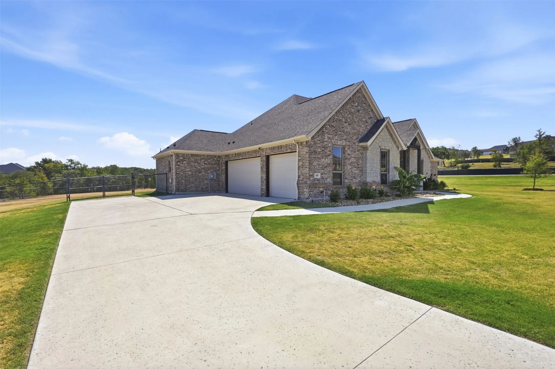 3 Car Garage with gated backyard access.