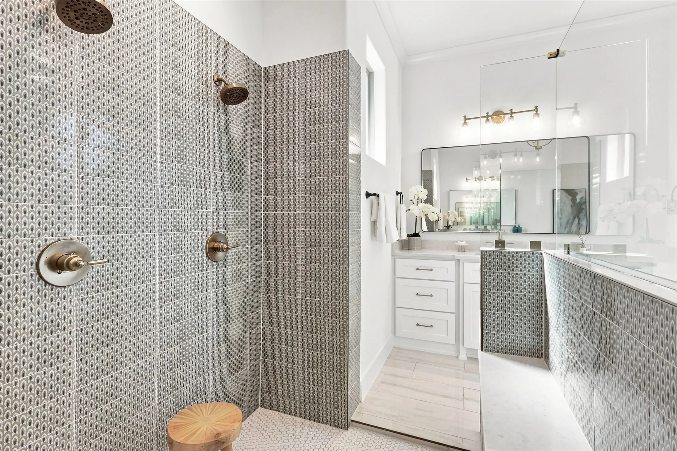 Dual shower heads with individual controls and built in seating