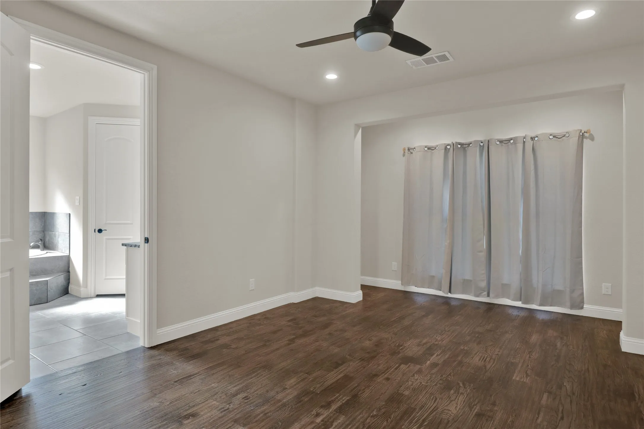 Master suite with sitting area overlooking back yard.