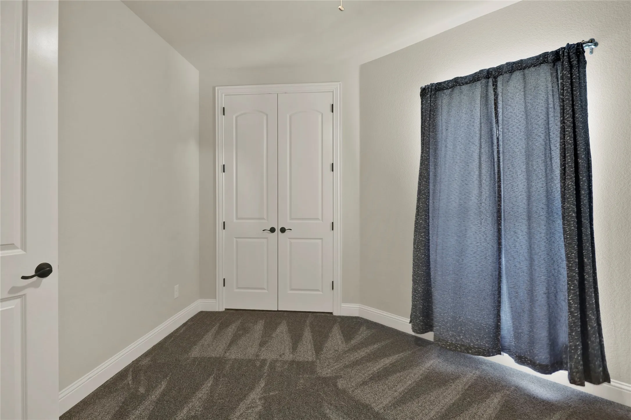 This secondary bedroom is near master and would make a great home office.