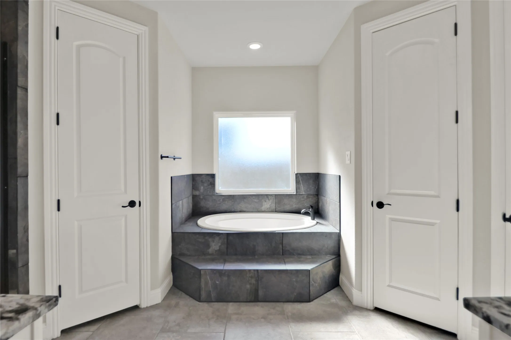 Master bath with garden tub. And his and her closets.