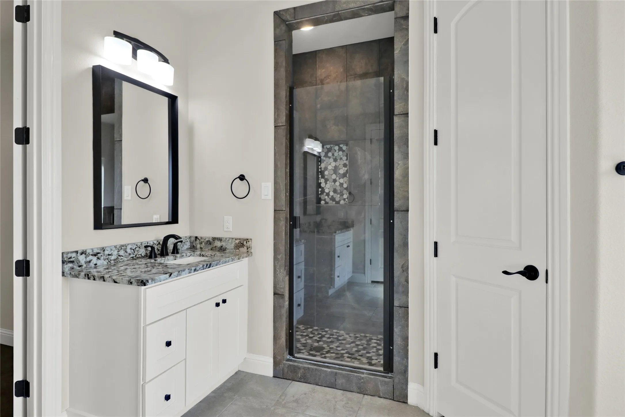 Master bath with dual vanities and separate shower.