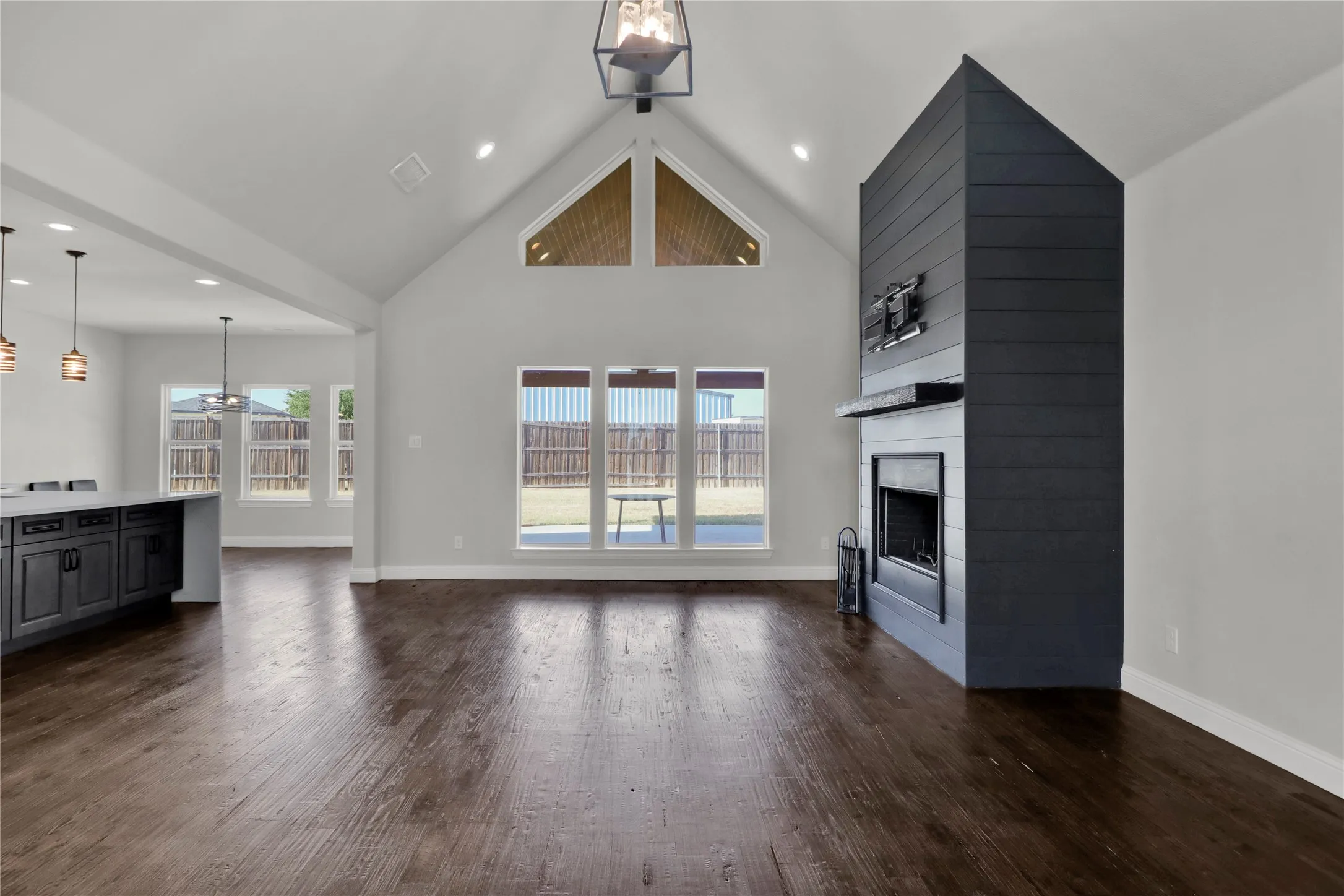 Living room with lots of windows for back yard and natural light.