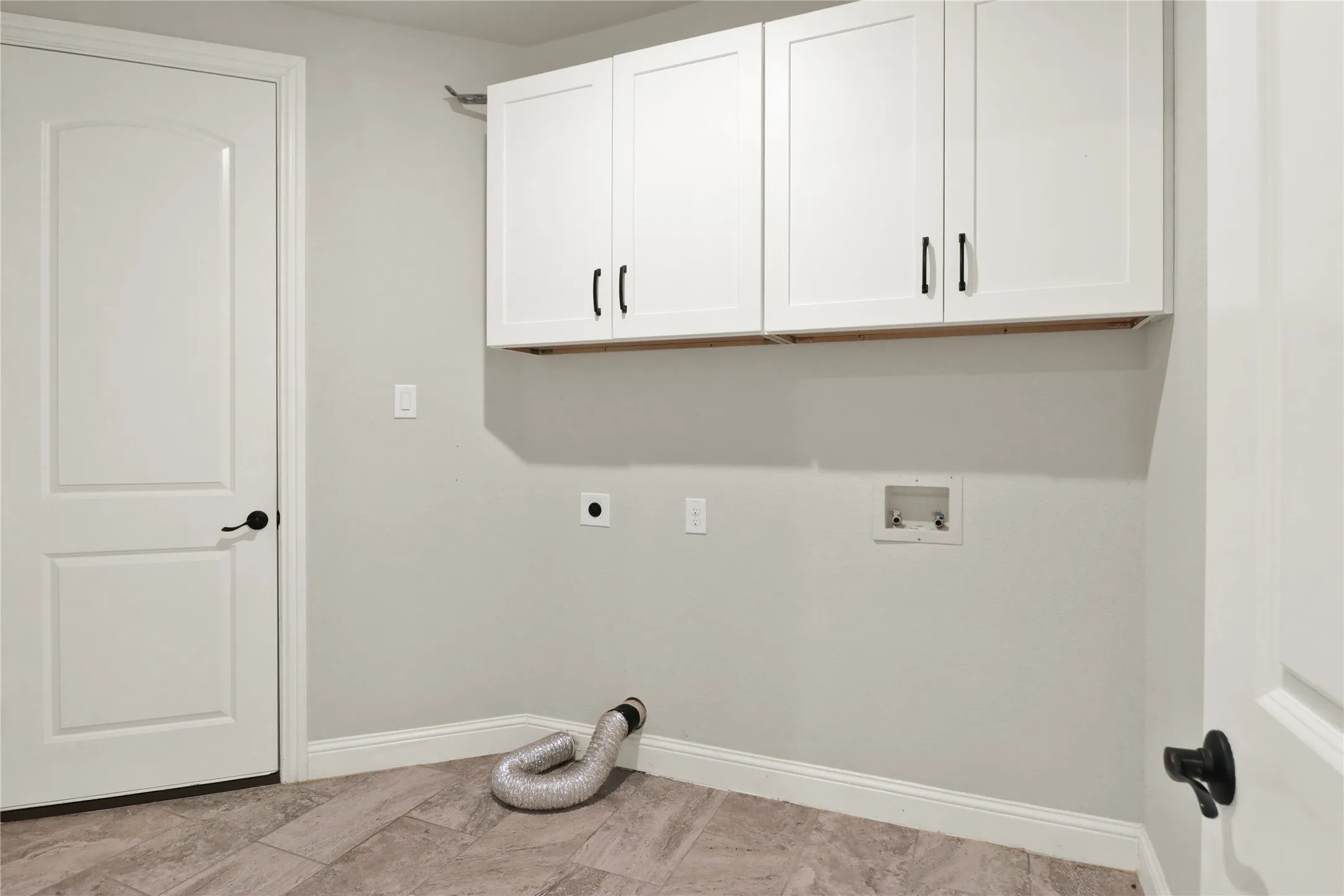 Laundry room with build in cabinets.