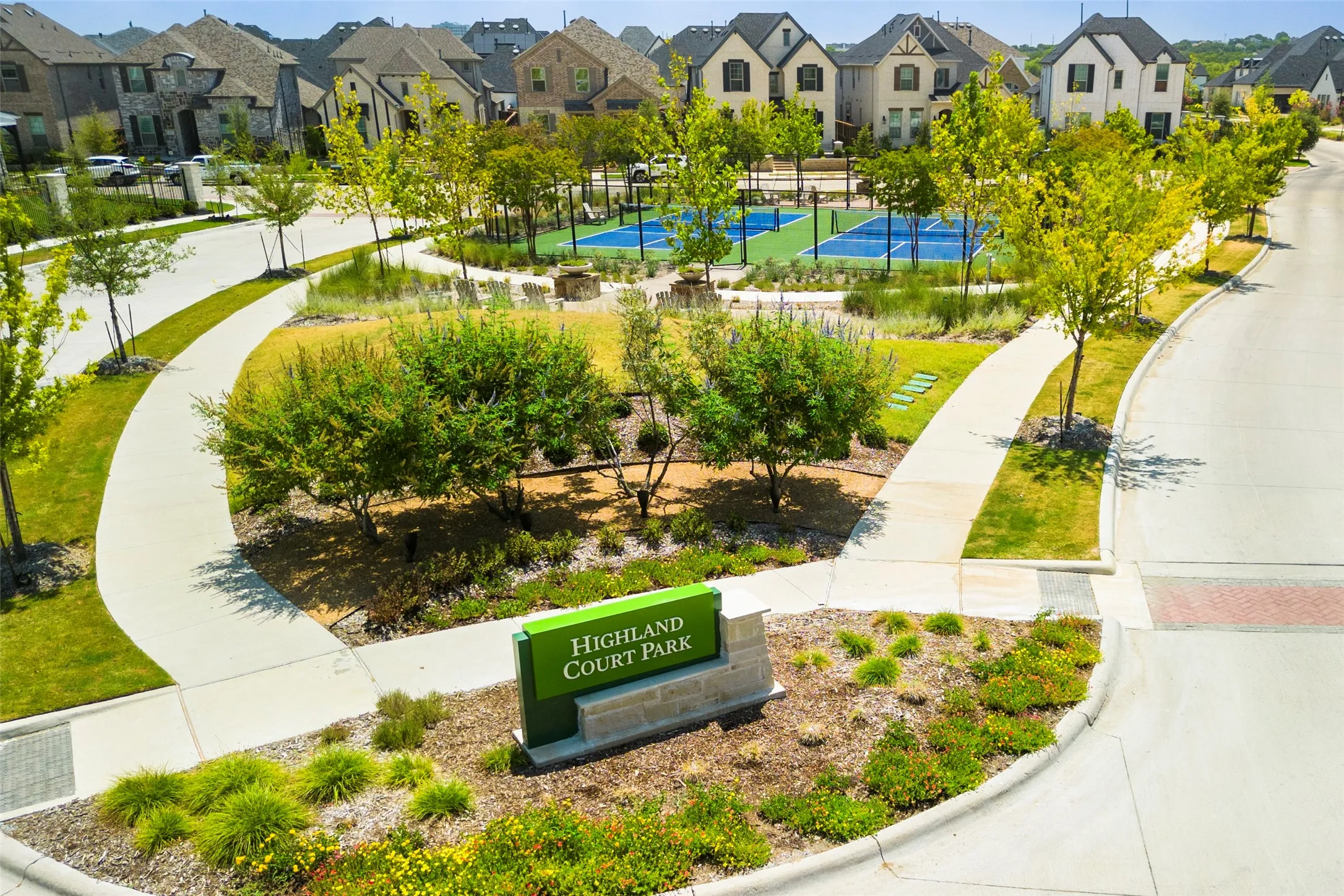 Highland Court Park at Viridian — Beautiful neighborhood green space featuring scenic walking paths, mature landscaping, open lawns and multiple pickleball courts. A welcoming community amenity offering residents an inviting place to enjoy outdoor recreation, relax and connect with neighbors.