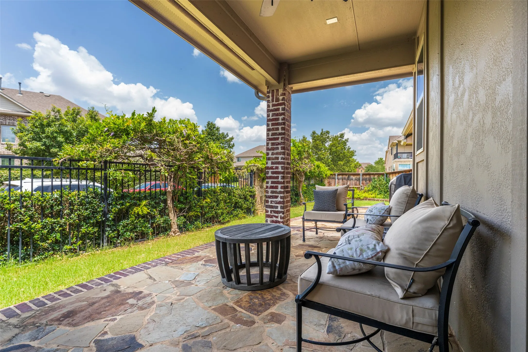 Oversized Covered Flagstone Patio: Enjoy peaceful outdoor living on this oversized covered flagstone patio overlooking a beautifully landscaped lawn. A spacious setting for outdoor dining, entertaining, or relaxing year-round. Located in the desirable Viridian master-planned community with a full sprinkler system for easy lawn and landscape maintenance.