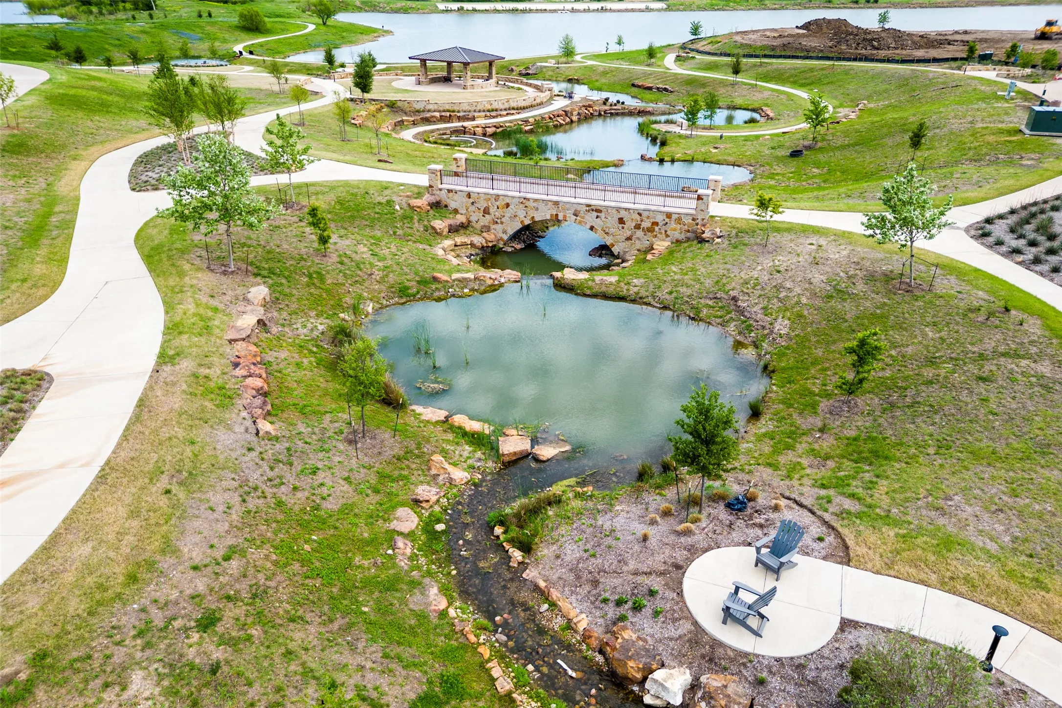 Viridian green space offers a peaceful connection to nature with scenic ponds, walking and biking trails, landscaped parks, native plantings, and inviting gathering areas. Beautifully designed waterways, stone bridges, open lawns, and shaded spaces create a serene outdoor setting for biking and hiking, relaxing, and enjoying the natural beauty of this sought-after master-planned community.