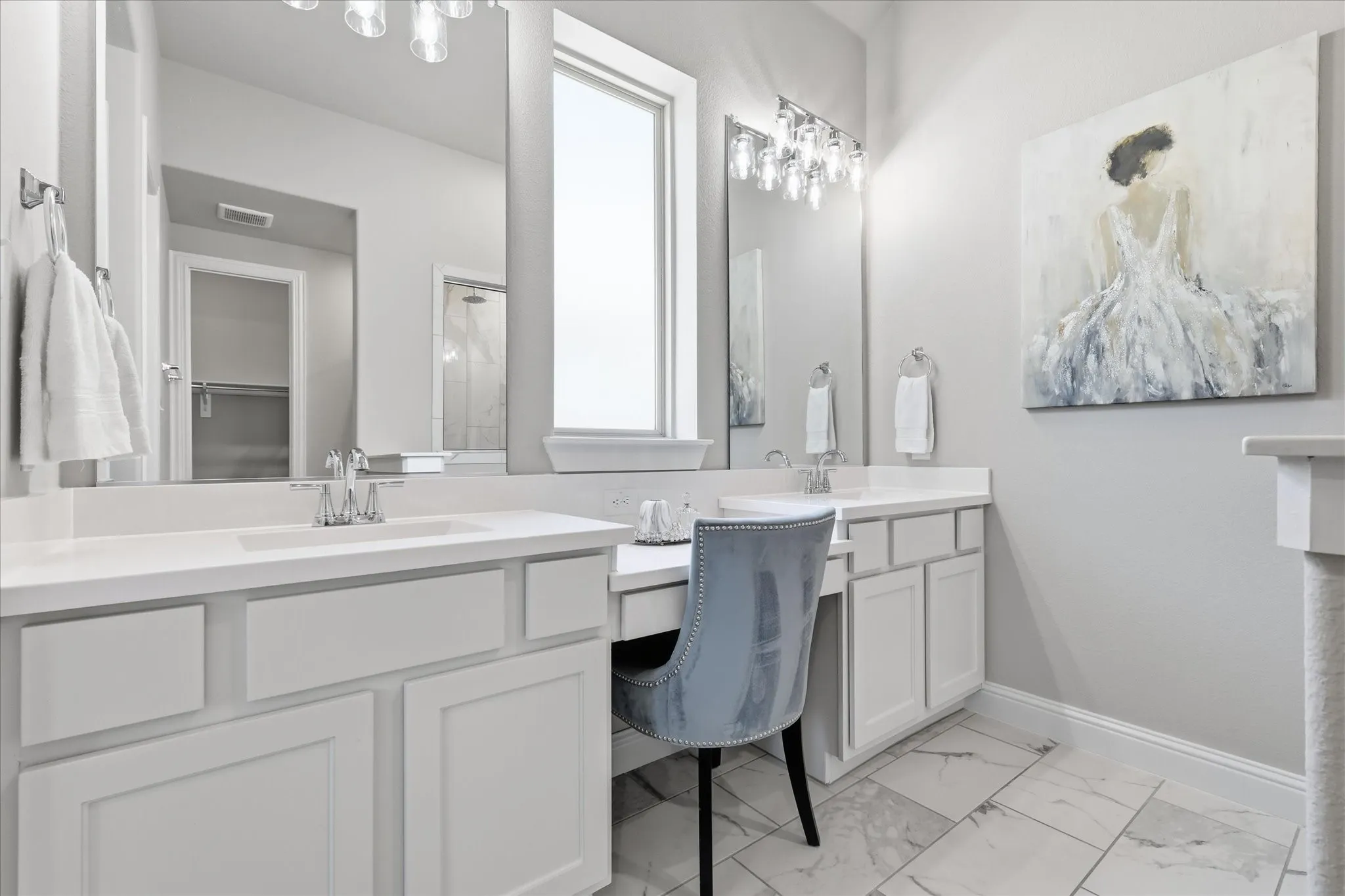 Dual vanities with undermount sinks, separate vanity area, and light-toned cabinetry