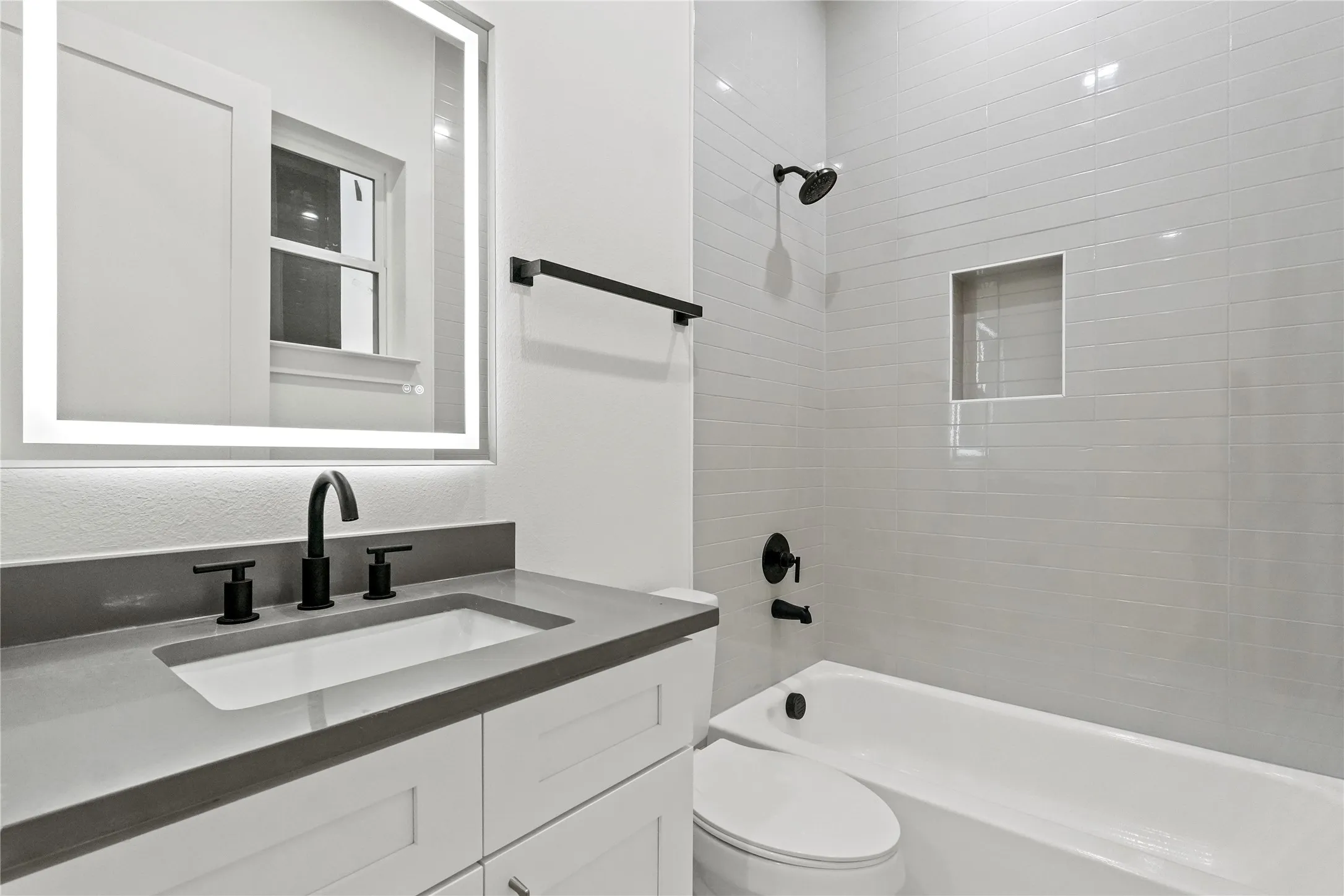 Bathroom featuring bathtub / shower combination and vanity