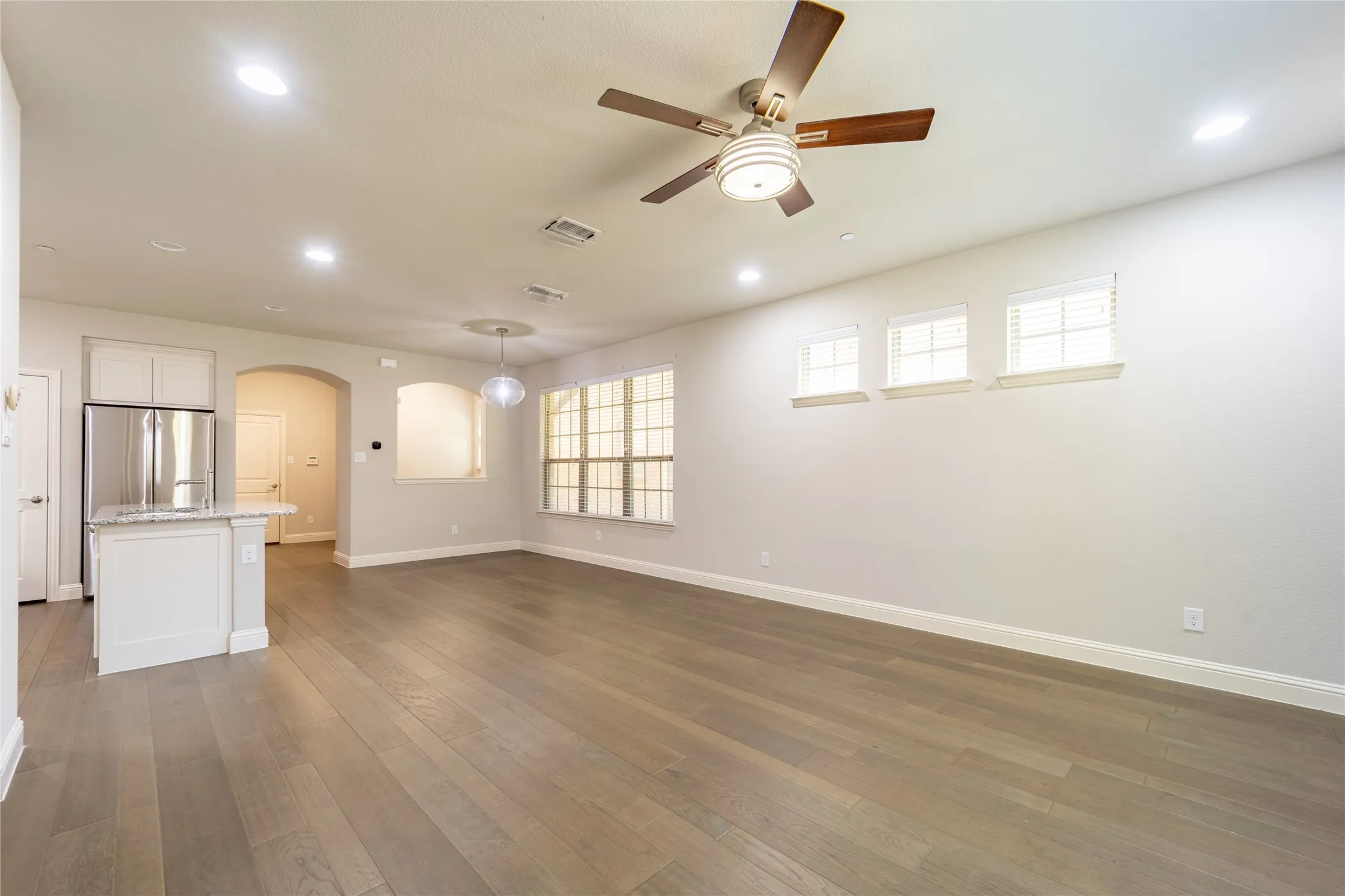 Open concept living with soaring ceilings and beautiful upgrades everywhere you look