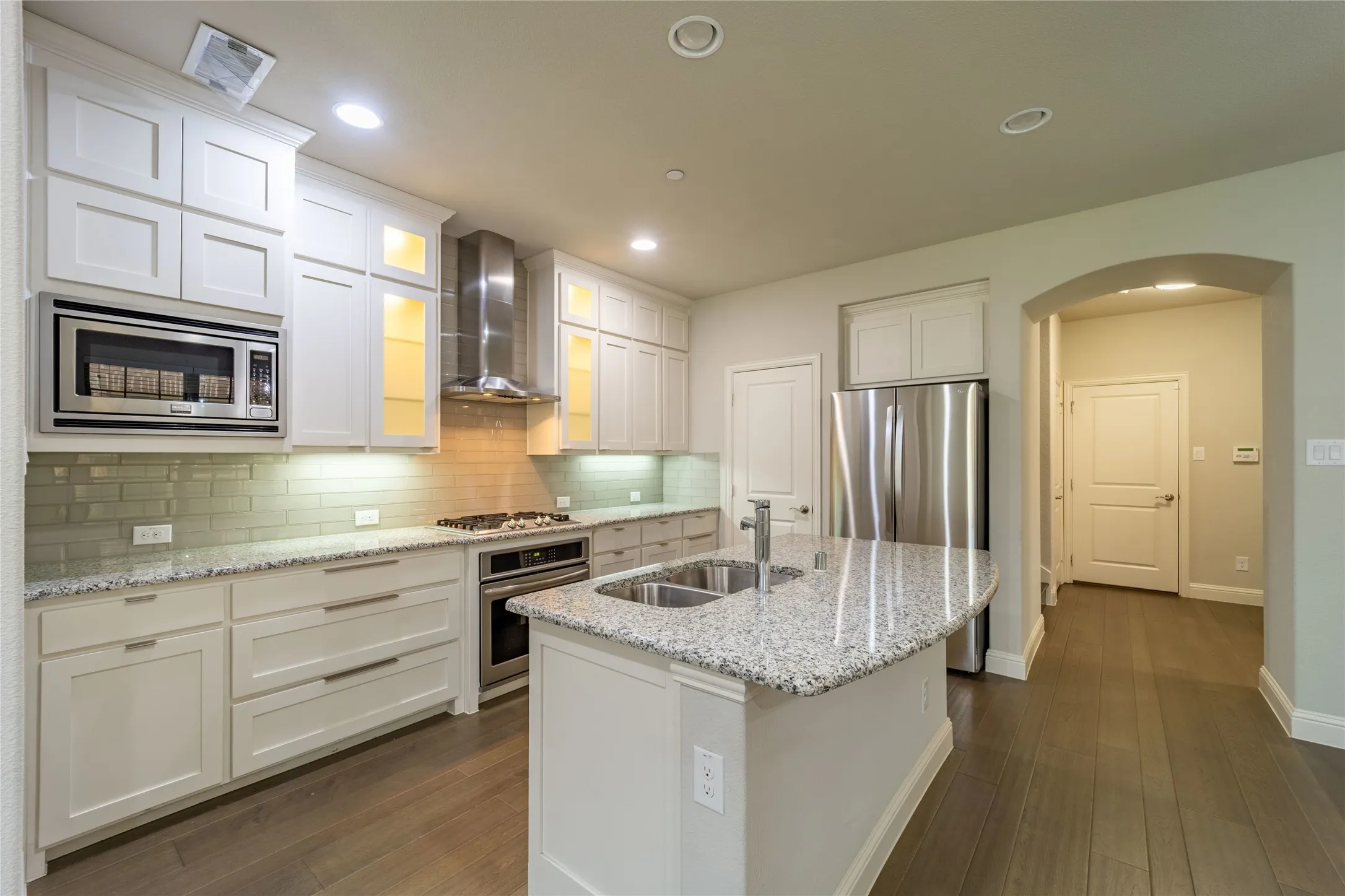 Center-island with breakfast bar and granite counters