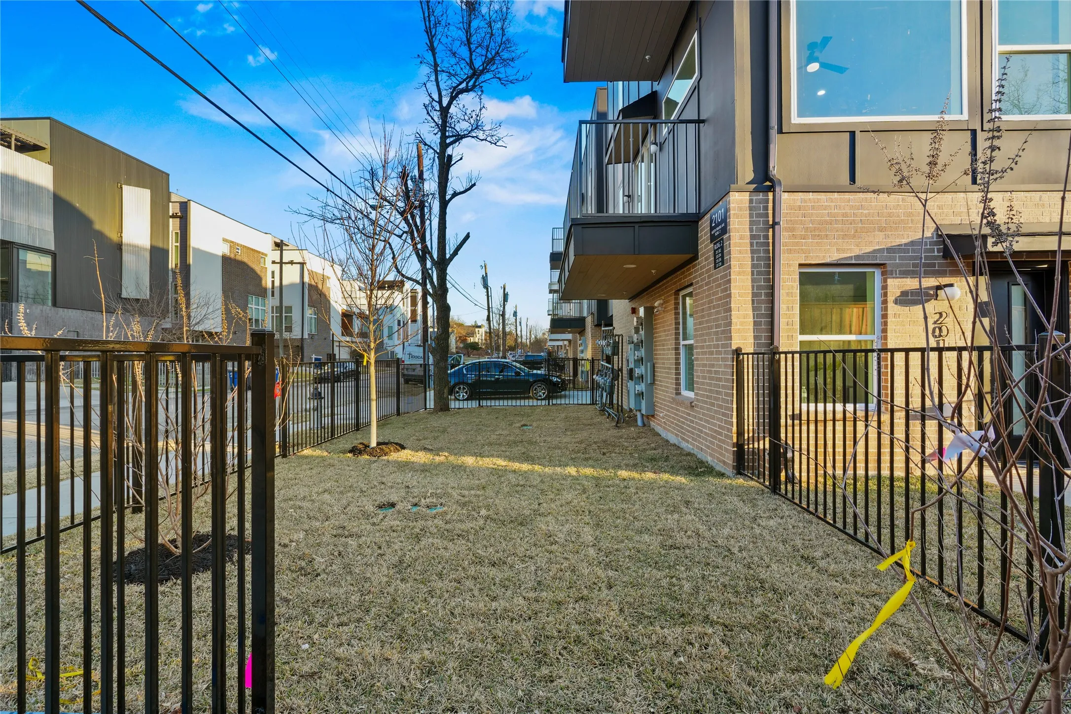 Fenced yard featuring a balcony