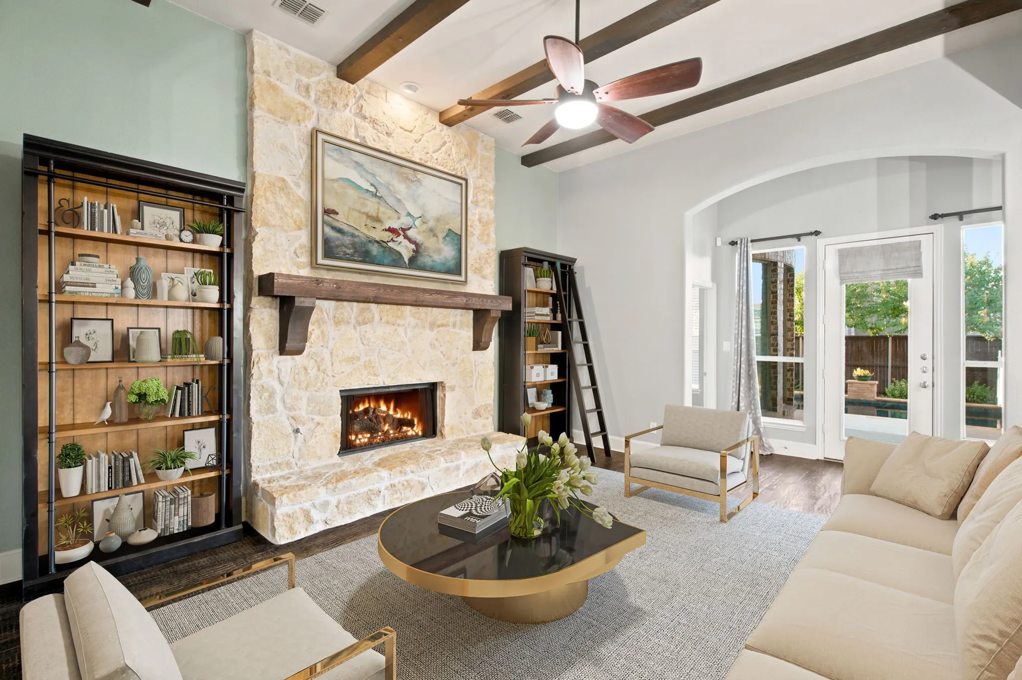 Stone-clad fireplace with a wood mantel.  Virtually staged.
